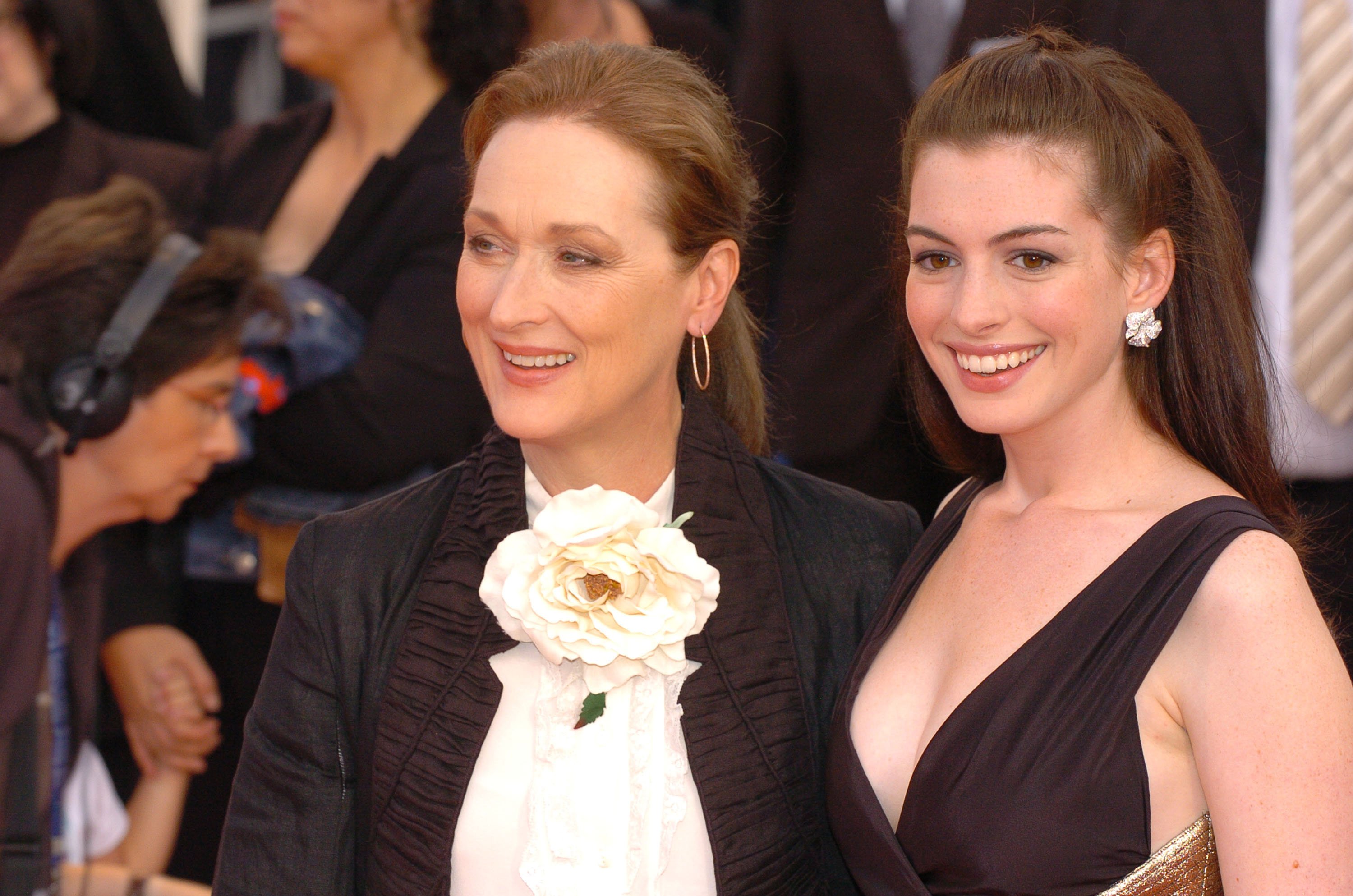 'The Devil Wears Prada' stars Anne Hathaway and Meryl Streep smiling at the film's premiere.
