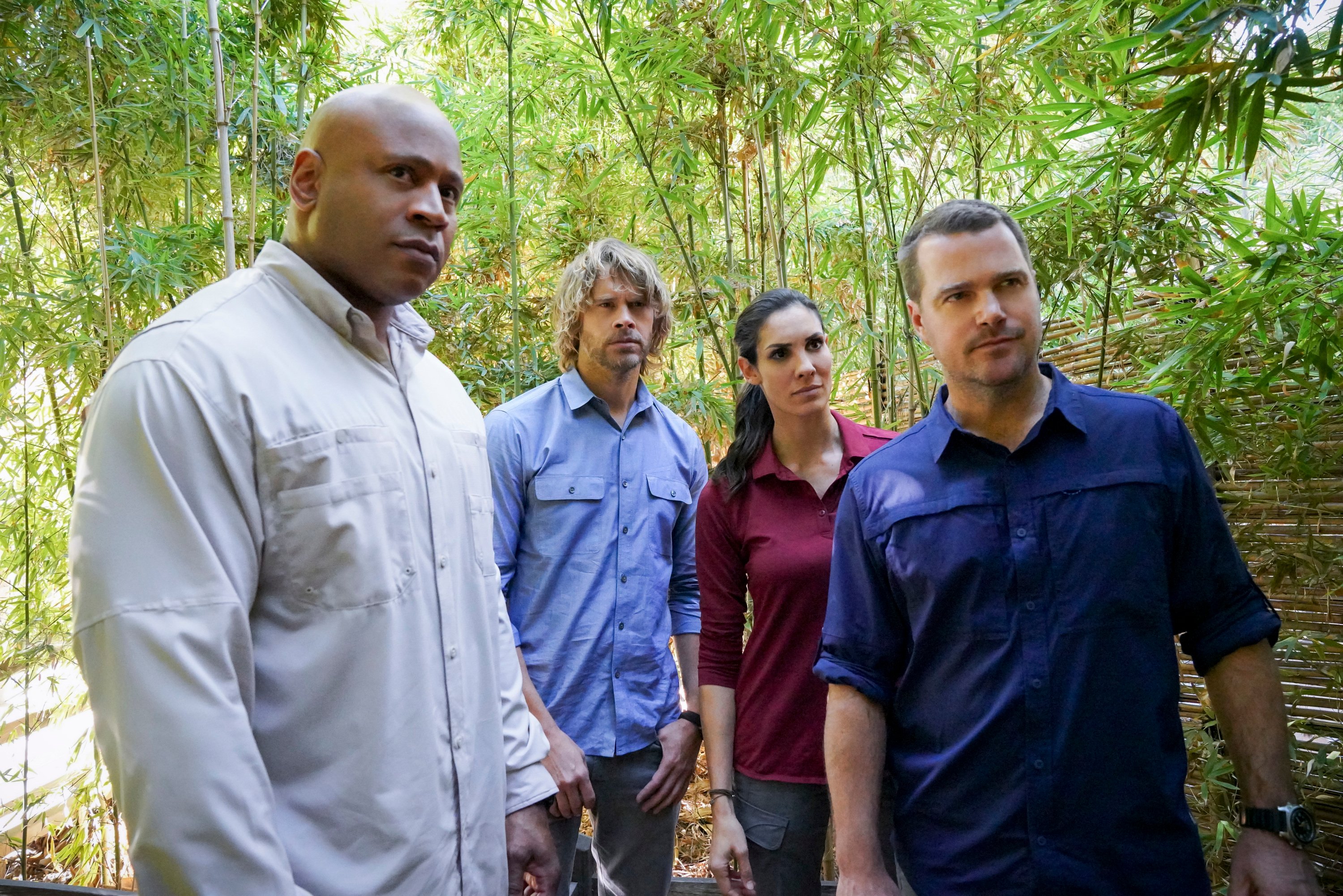 Actors LL Cool J, Eric Christian Olsen, Daniela Ruah, and Chris O'Donnell stand outside in a scene from 'NCIS: Los Angeles.'
