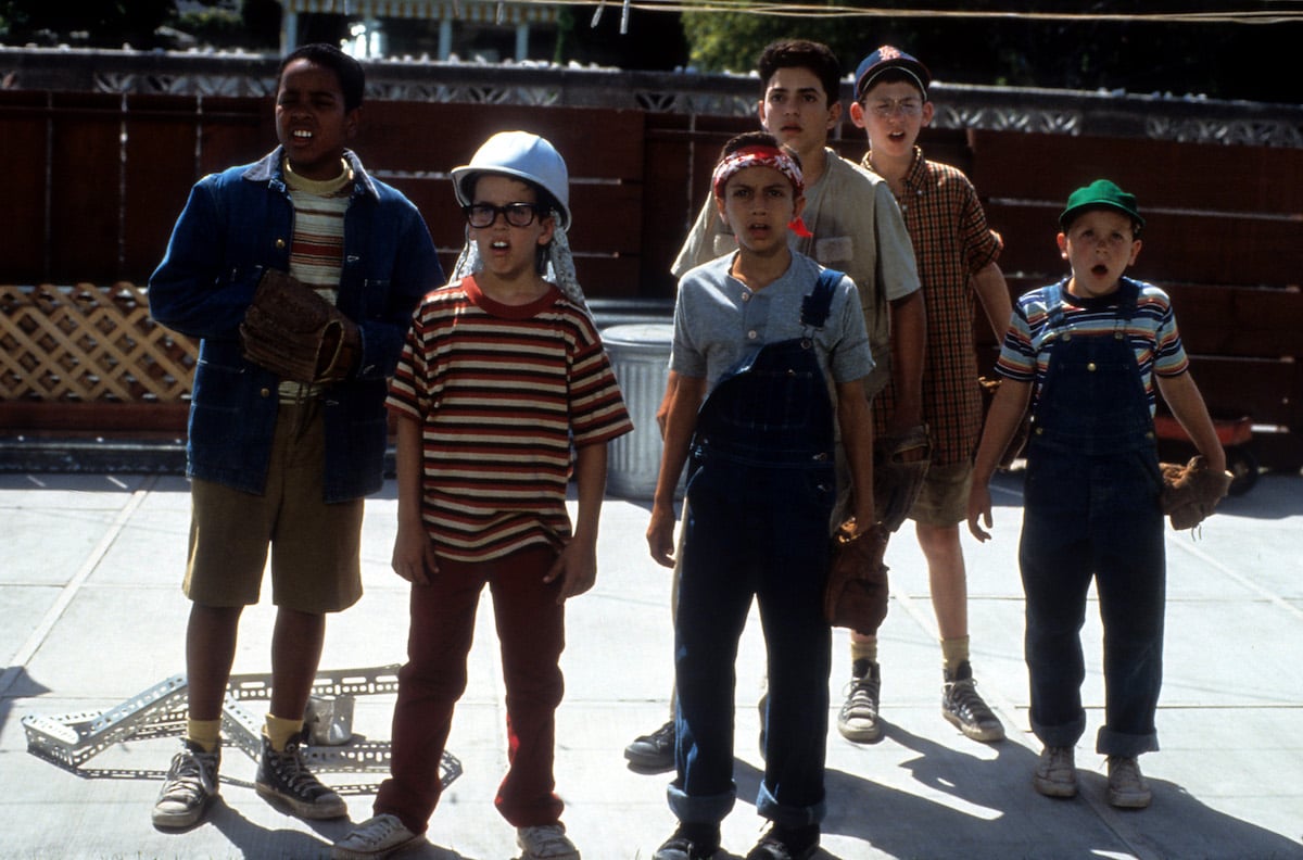 Brandon Quintin Adams as Kenny DeNunez, Chauncey Leopardi as Michael 'Squints' Palledorous, Patrick Renna as Hamilton 'Ham' Porter, Mike Vitar as Benjamin Franklin Rodriguez, Tom Guiry as Scotty Smalls,  Art LaFleur as The Babe stand outside looking shocked in 'The Sandlot' 