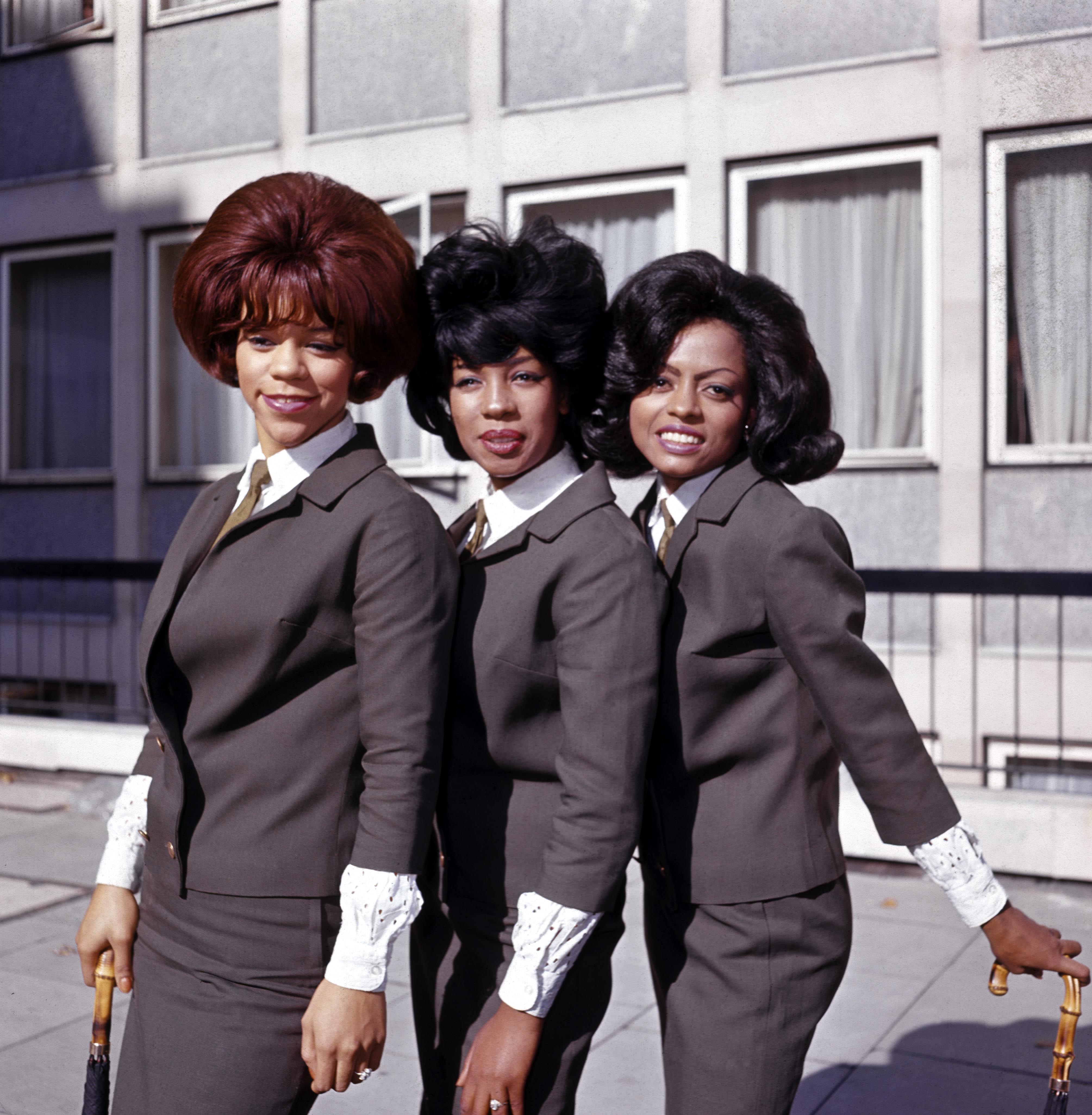 The Supremes: (L-R): Florence Ballard, Mary Wilson and Diana Ross wearing matching outfits and posing for the camera.