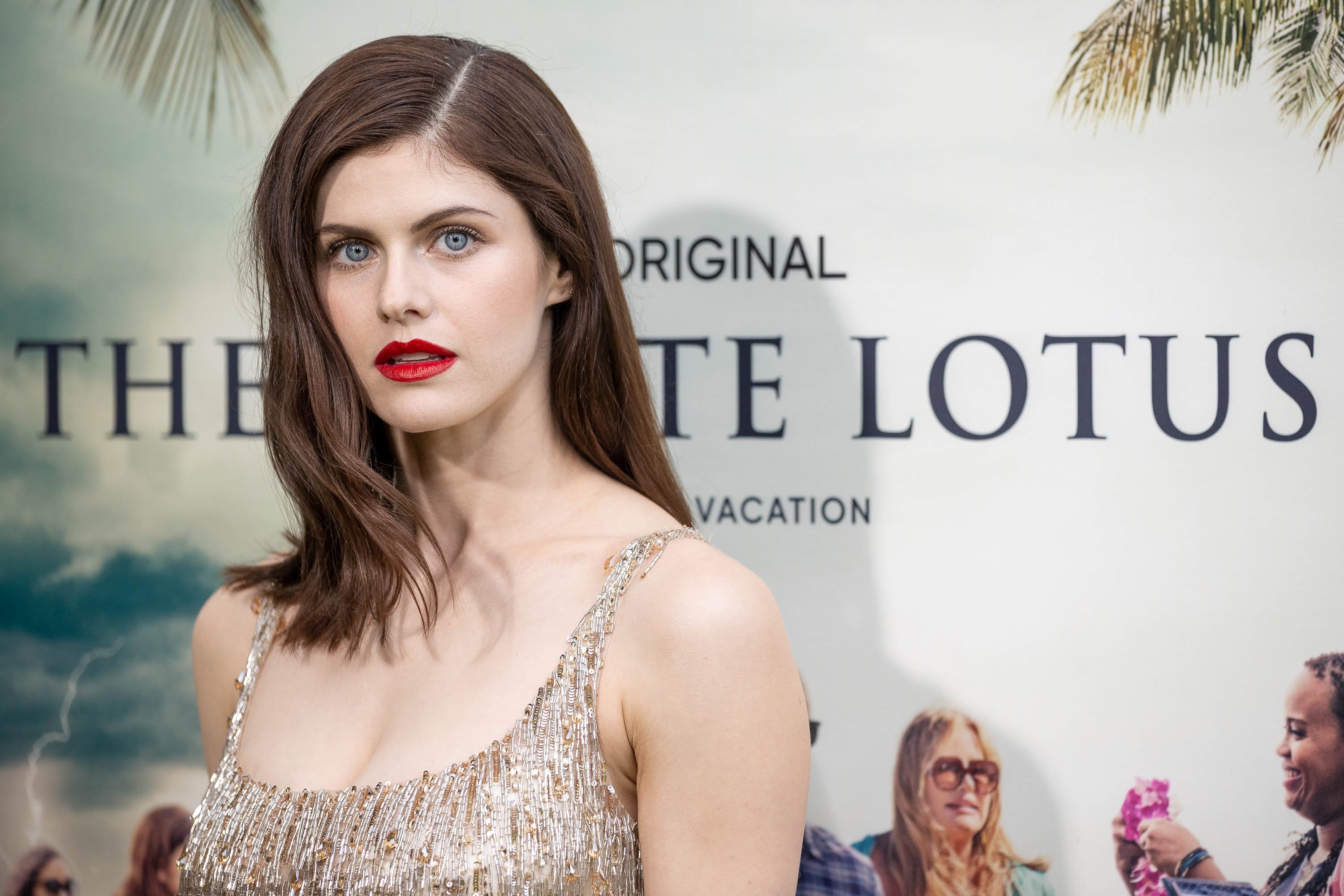 Alexandra Daddario as Rachel in The White Lotus posing for the premiere as fans guess if she was the one who dies in the HBO series
