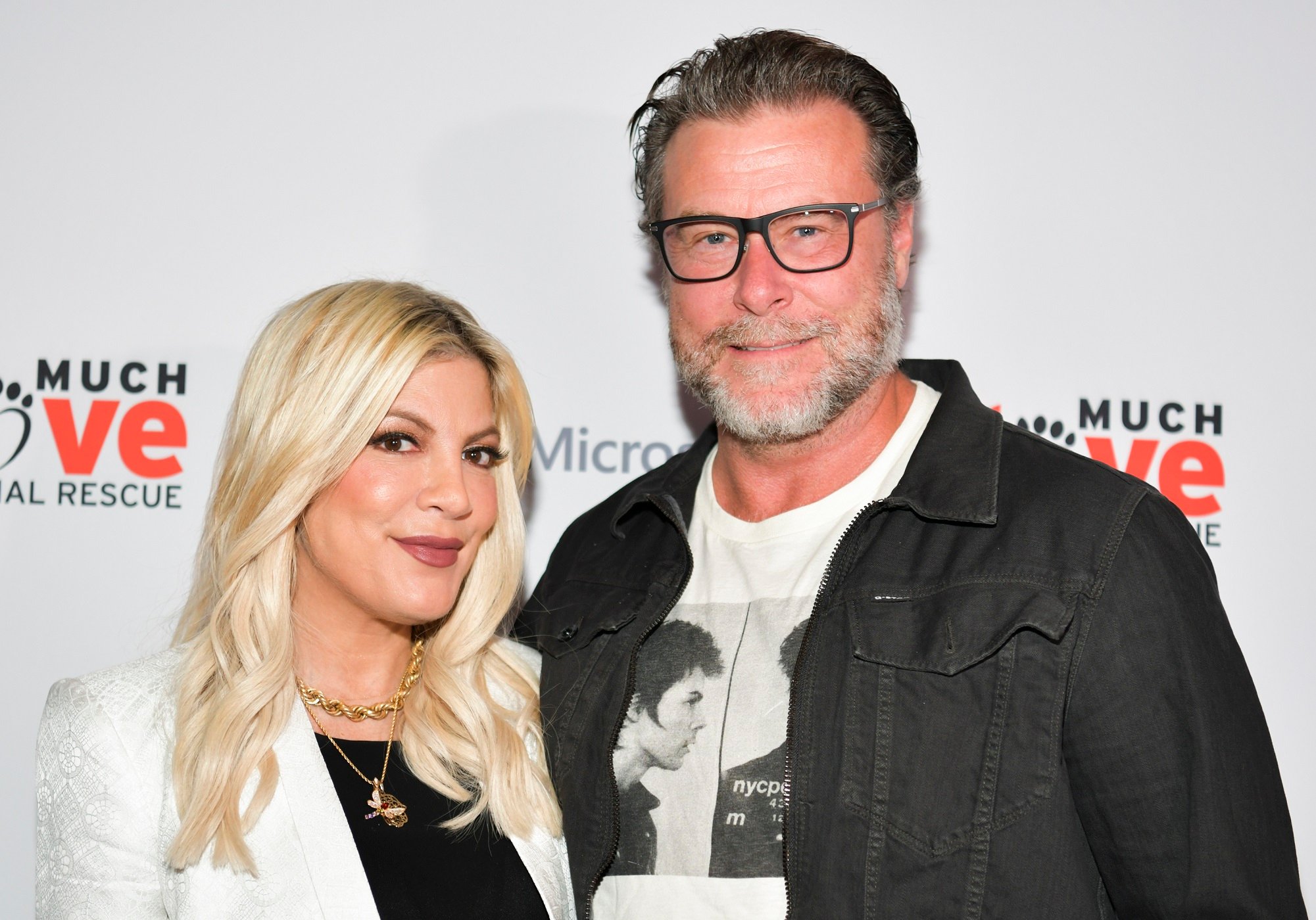 Tori Spelling and Dean McDermott pose for a photo after arriving at the Much Love Animal Rescue 3rd Annual Spoken Woof Benefit in 2019