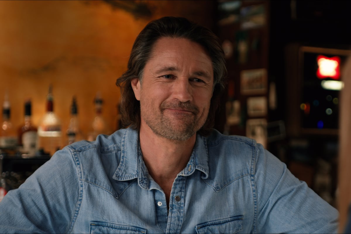 Smiling Jack (Martin Henderson) wearing a blue shirt in 'Virgin River' Season 3