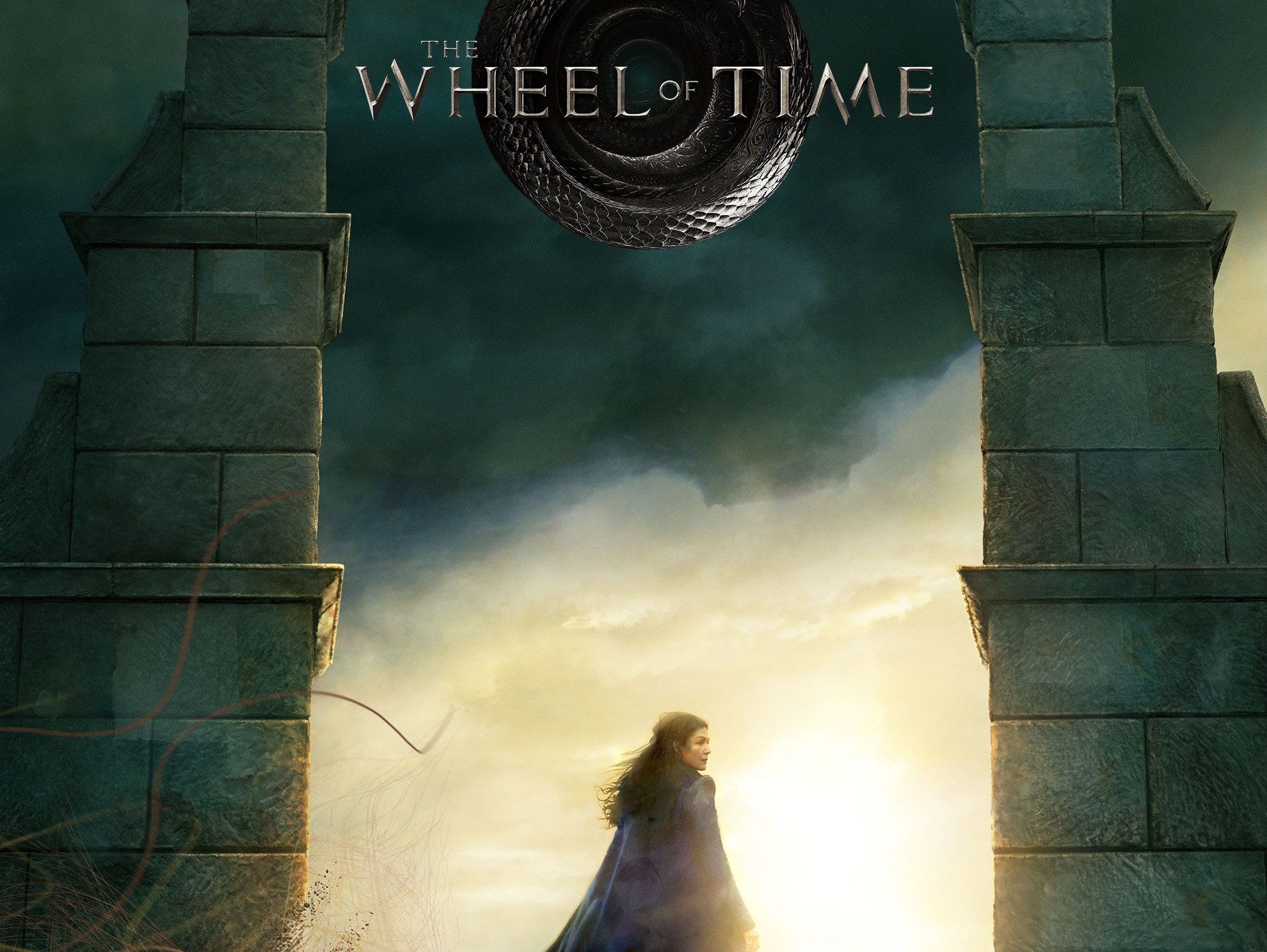 Poster for Amazon's Wheel of Time series shows Rosamund Pike's Moiraine standing in an archway