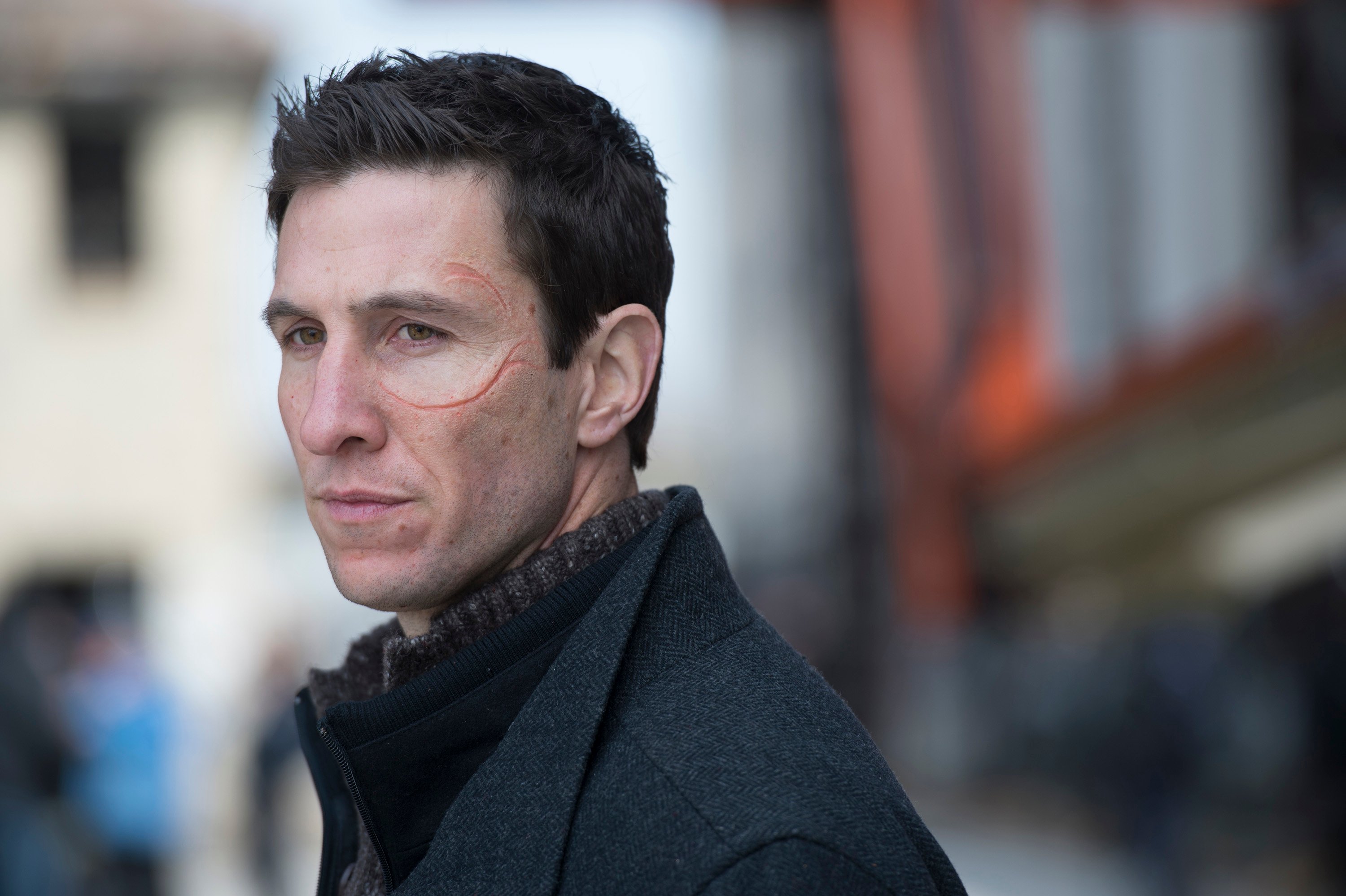 Pablo Schreiber as William Lewis, with circular scar on his face, in 'Law & Order: SVU'