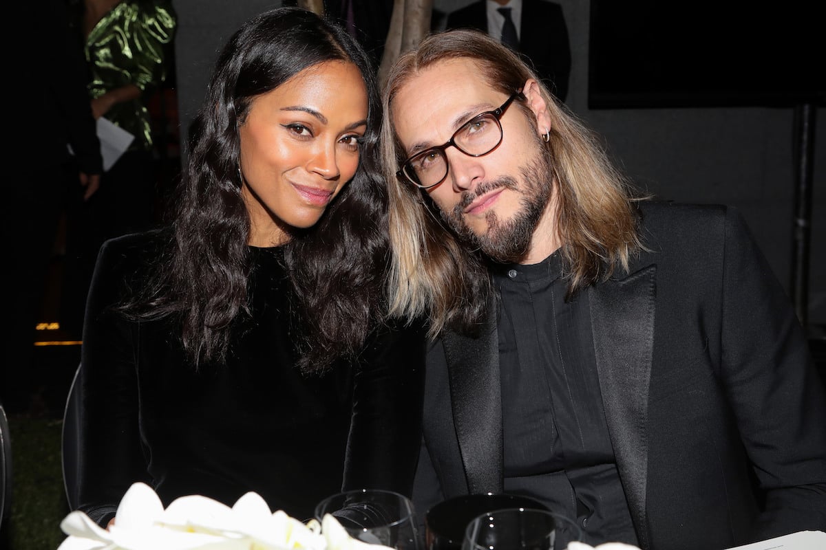 Zoe Saldana and Marco Perego at a table