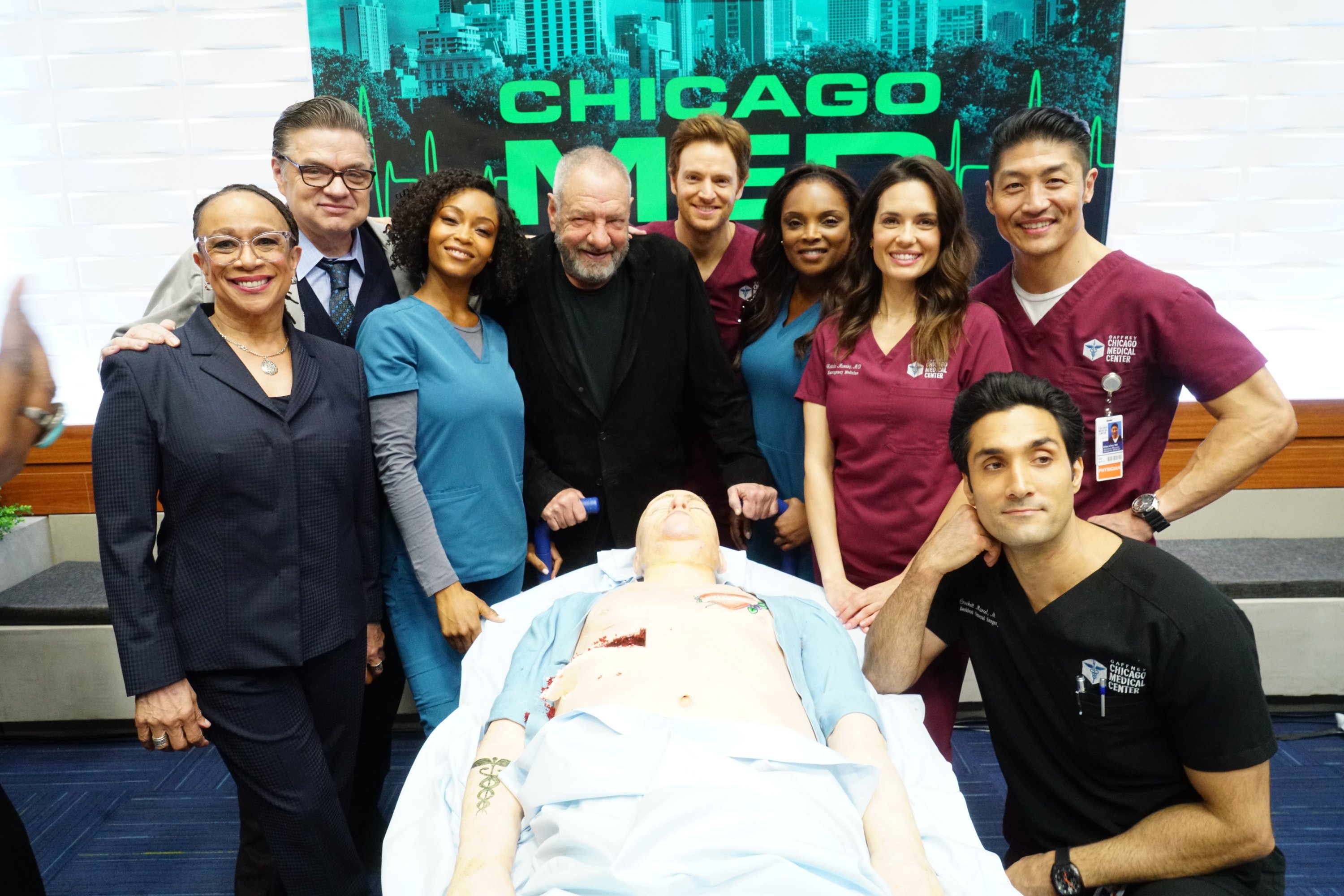 The Chicago Med cast stands together. 