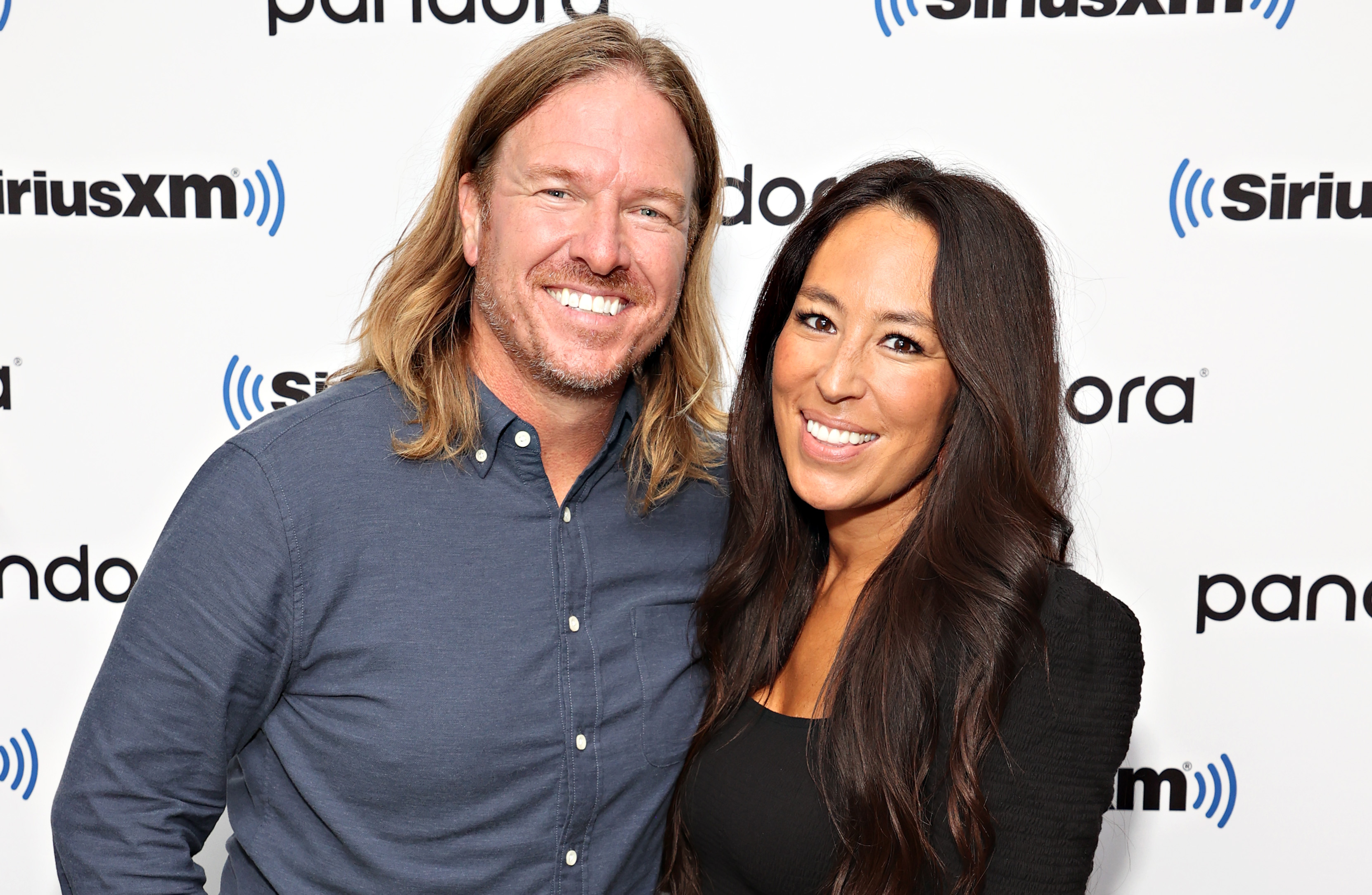 Chip and Joanna Gaines smiling during an appearance on SiriusXM