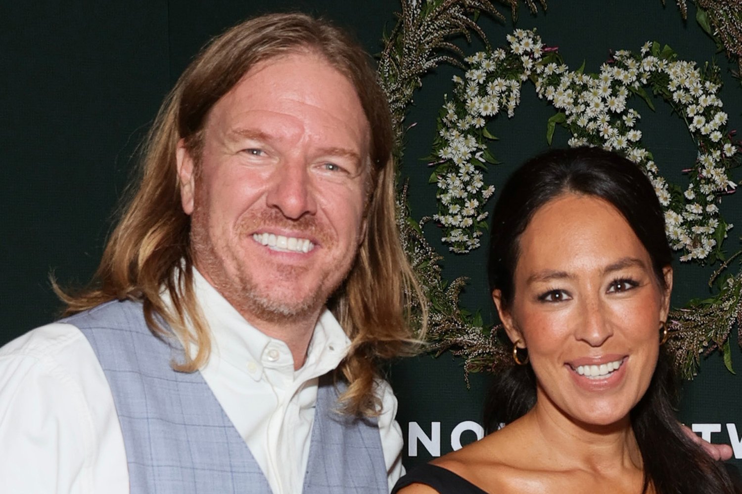 Chip and Joanna Gaines smiling for the camera