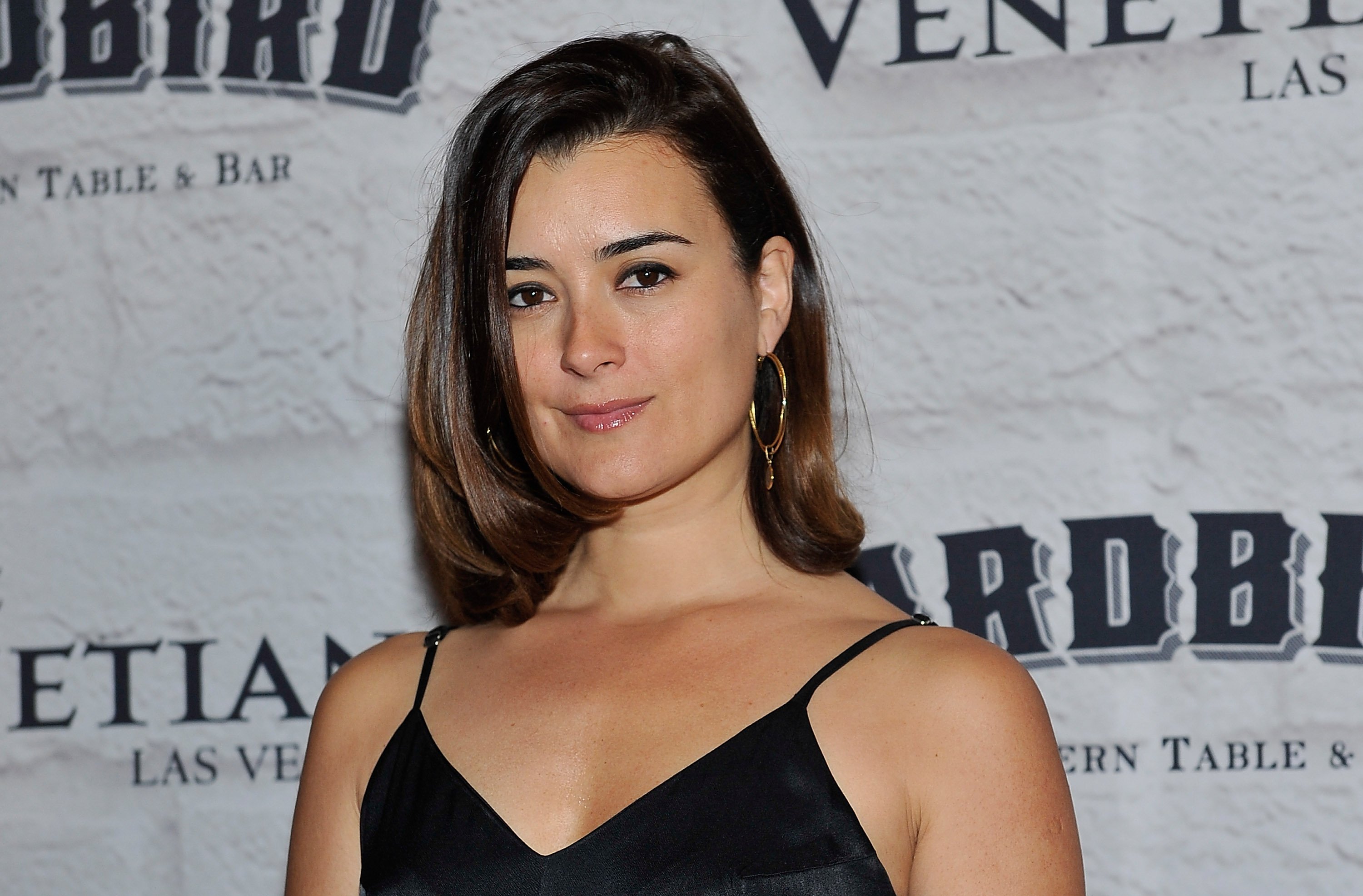 Cote de Pablo in a black outfit