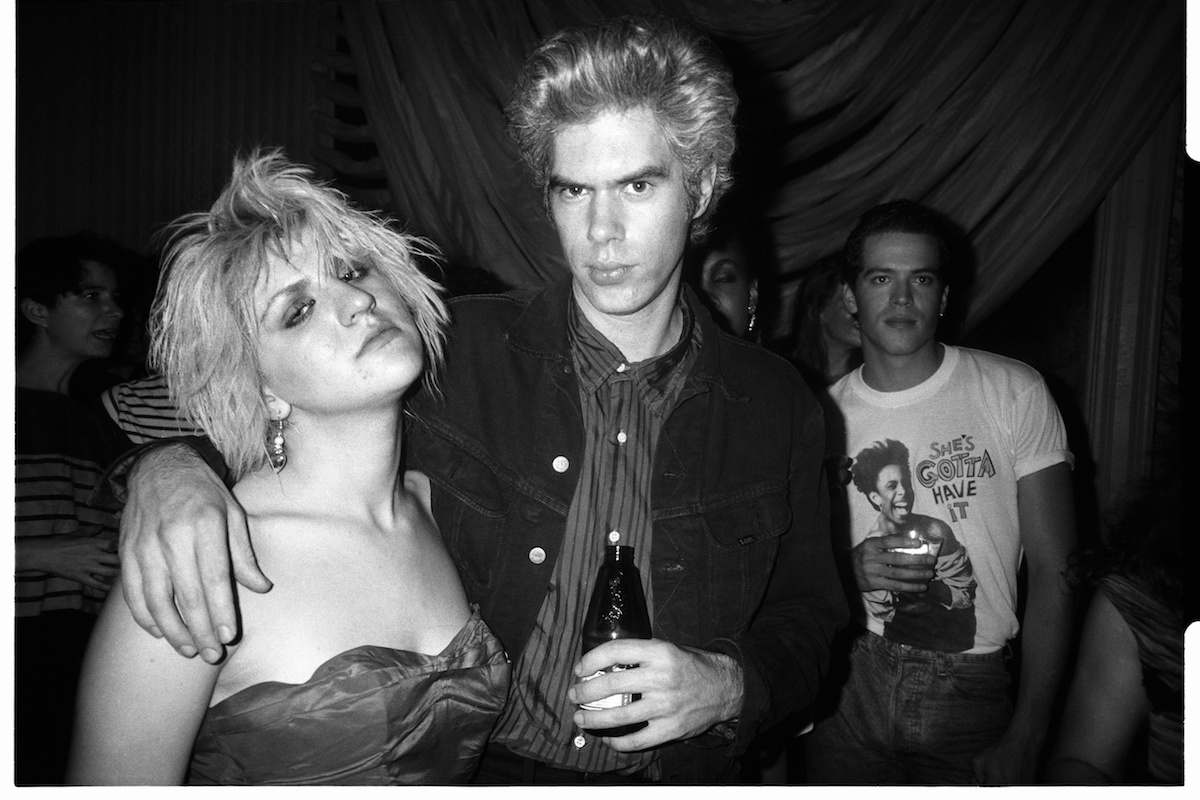 Black and white photo of Courtney Love and Jim Jarmusch at a party for 'Sid & Nancy'