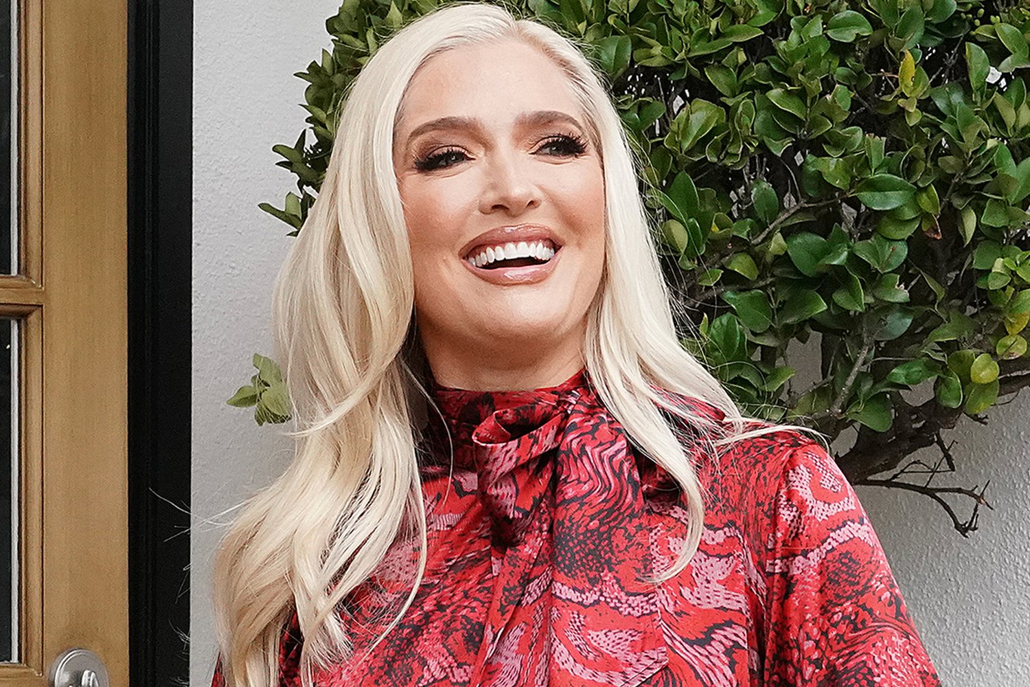 Erika Jayne smiling wide during a 'RHOBH' Season 11 scene