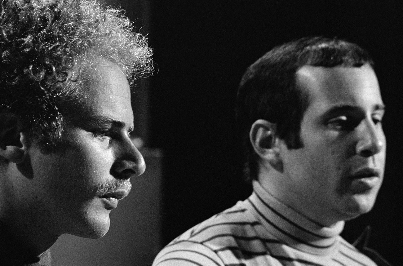 Art Garfunkel and Paul Simon look on during a 1967 appearance on 'The Smothers Brothers Comedy Hour' 