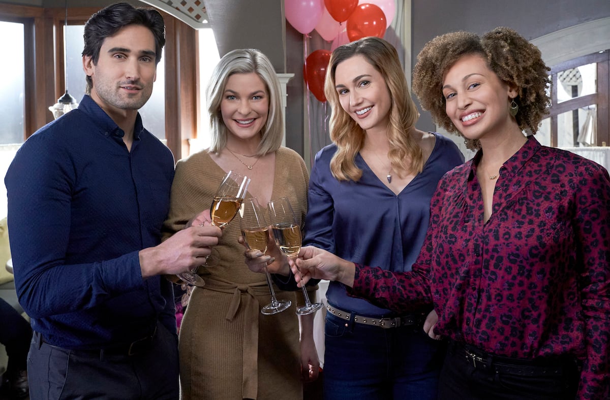 Adam, Stephanie, Joy and Zoey holding champagne flutes in 'Good Witch'