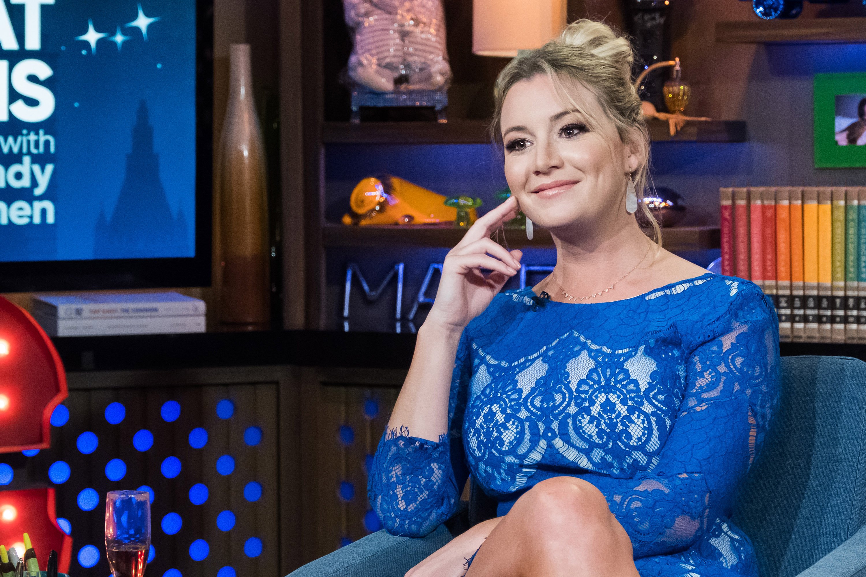 Hannah Ferrier smiles while seated on the set of 'Watch What Happens Live.'