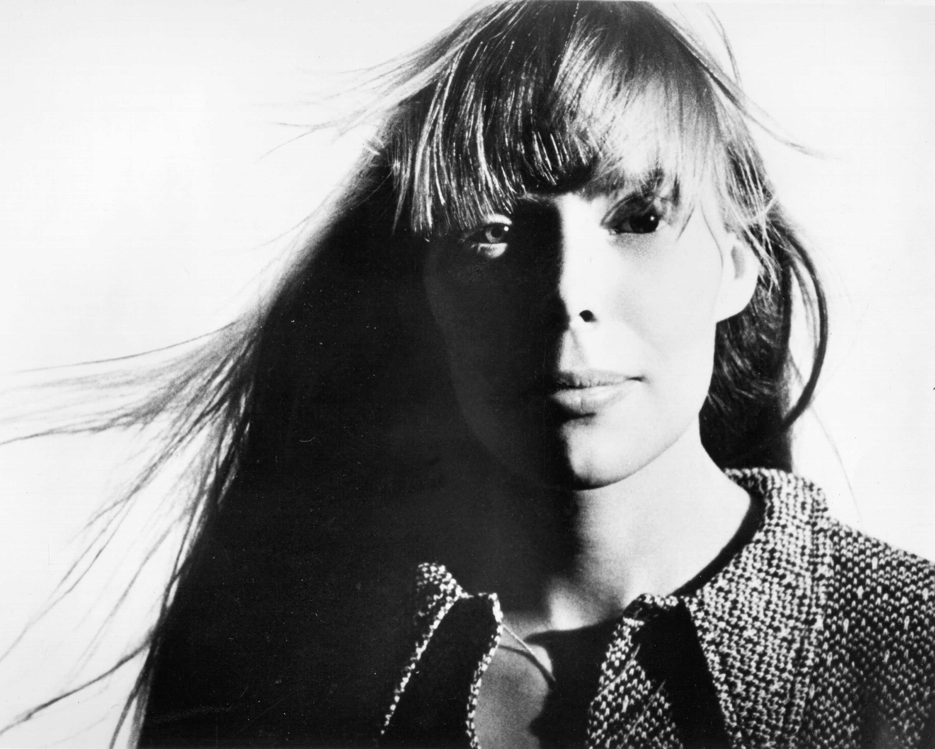 Joni Mitchell pictured with her hair blowing in the wind