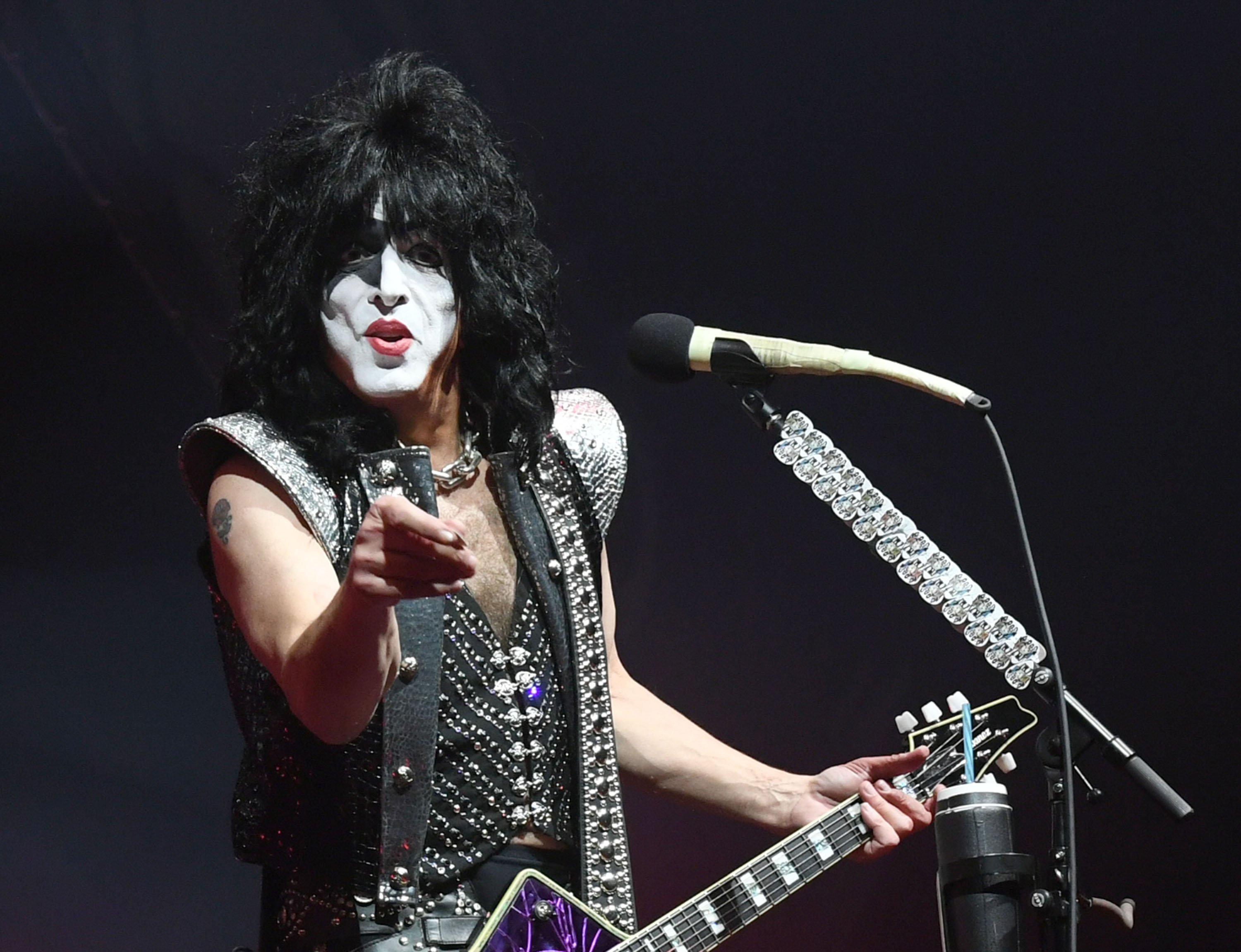 Kiss' Paul Stanley with a microphone