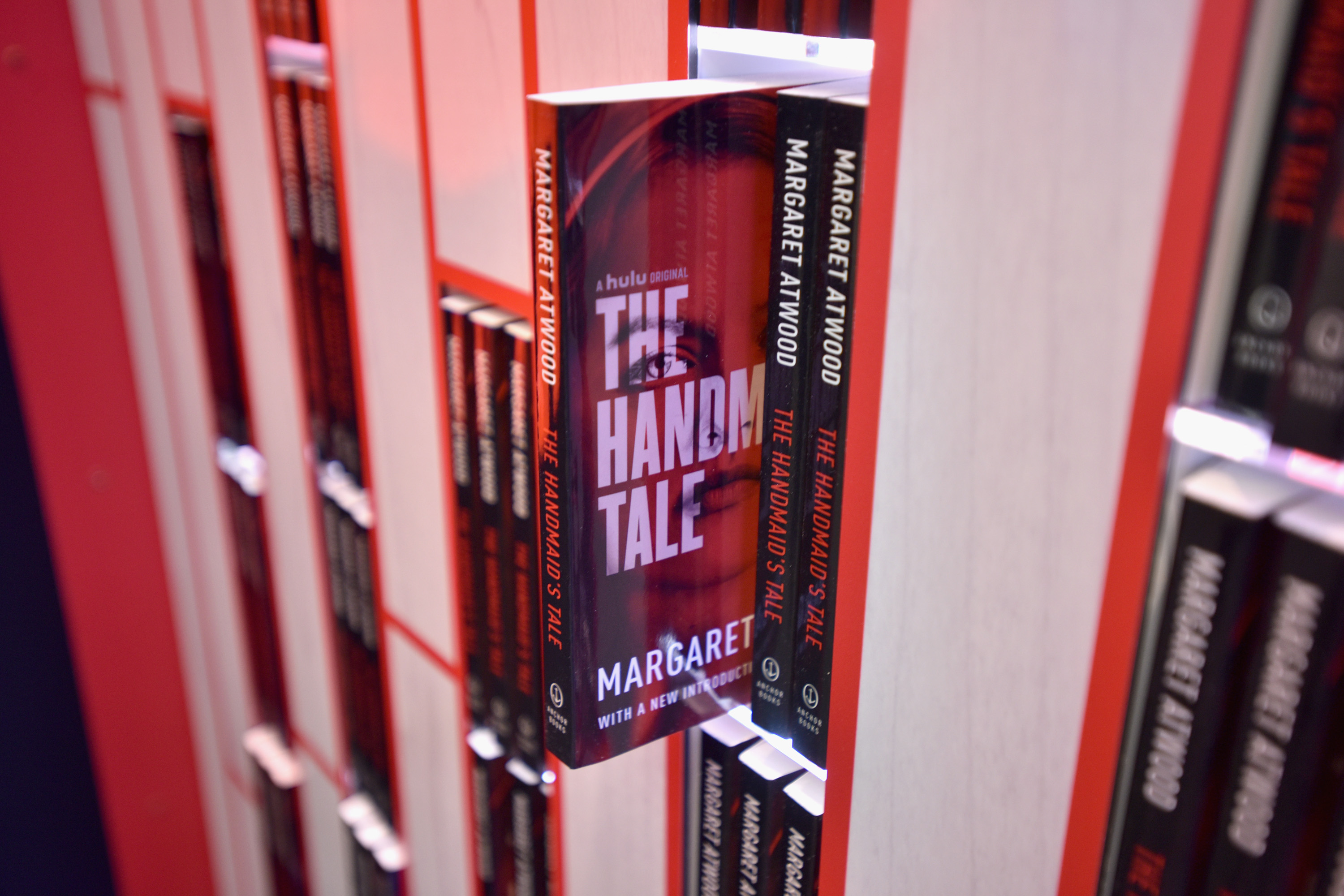 Copies of Margaret Atwood's book 'The Handmaid's Tale' sticking on shelves