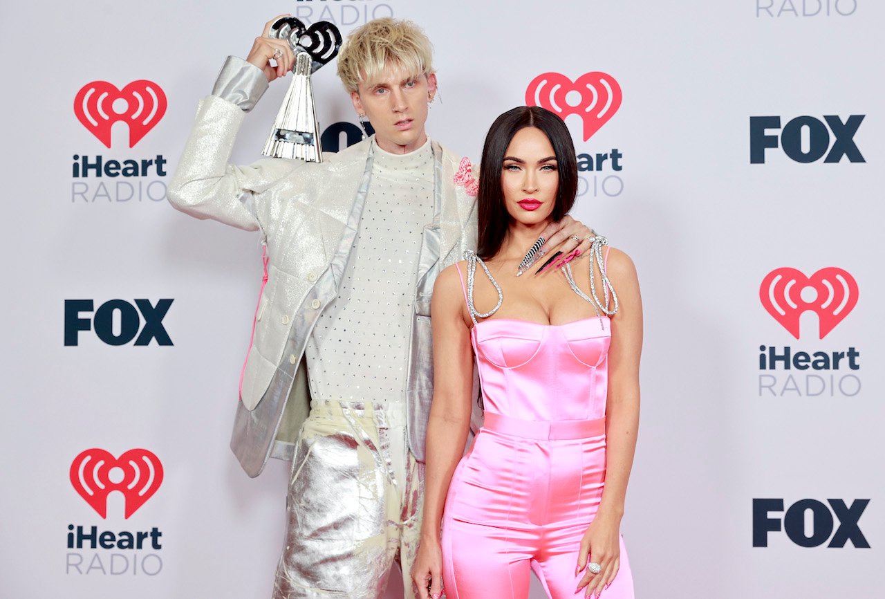 Machine Gun Kelly, winner of the Alternative Rock Album of the Year award for 'Tickets To My Downfall,’ and Megan Fox attend the 2021 iHeartRadio Music Awards