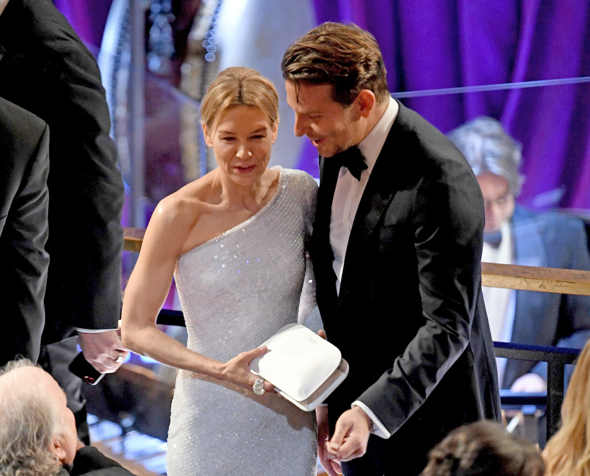 Bradley Cooper leans in to talk to Renee Zellweger at the 2020 Academy Awards