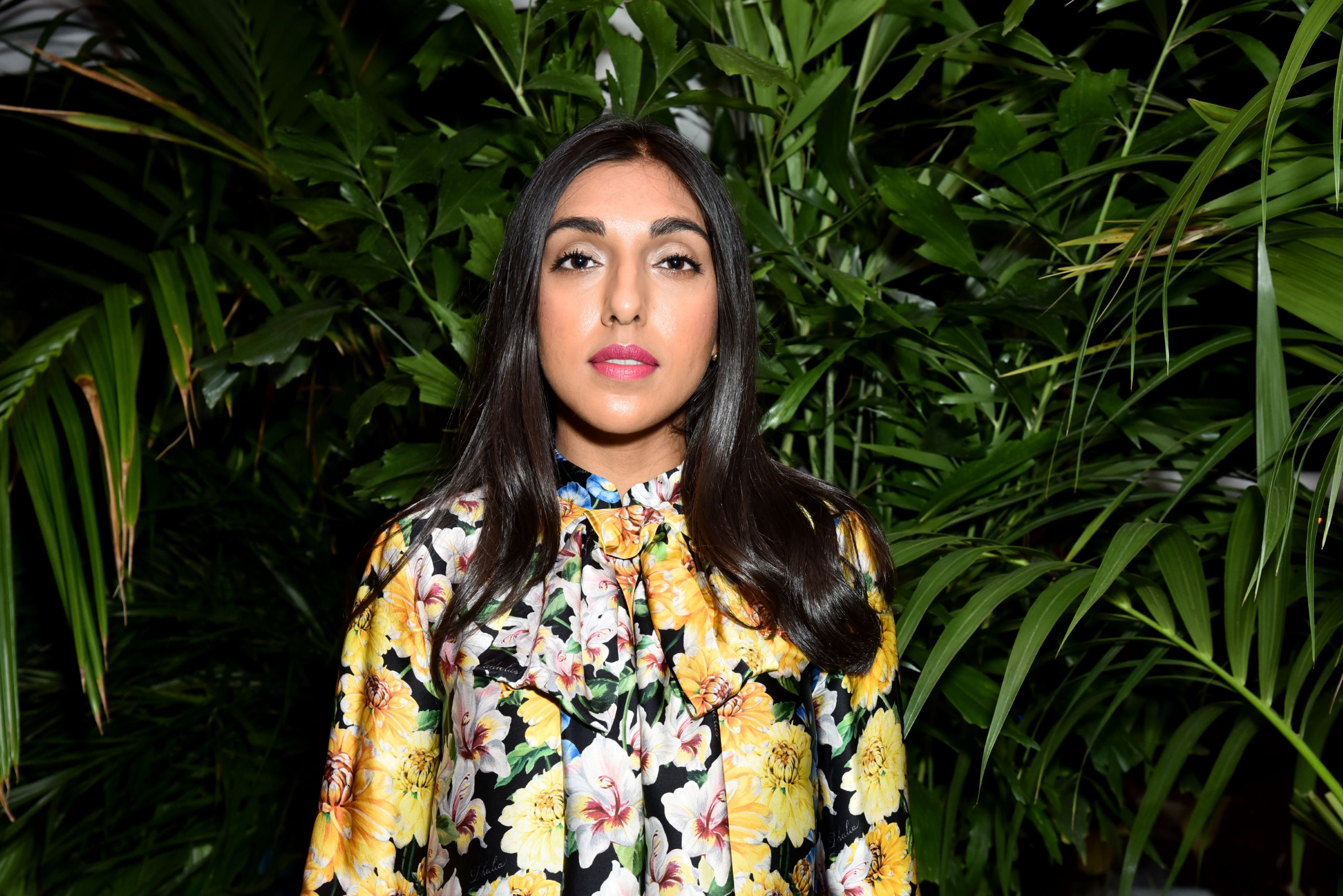 Rupi Kaur in a floral outfit