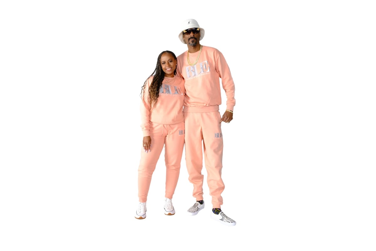 Shante Broadus with husband Snoop Dogg pose in Boss Lady Entertainment gear