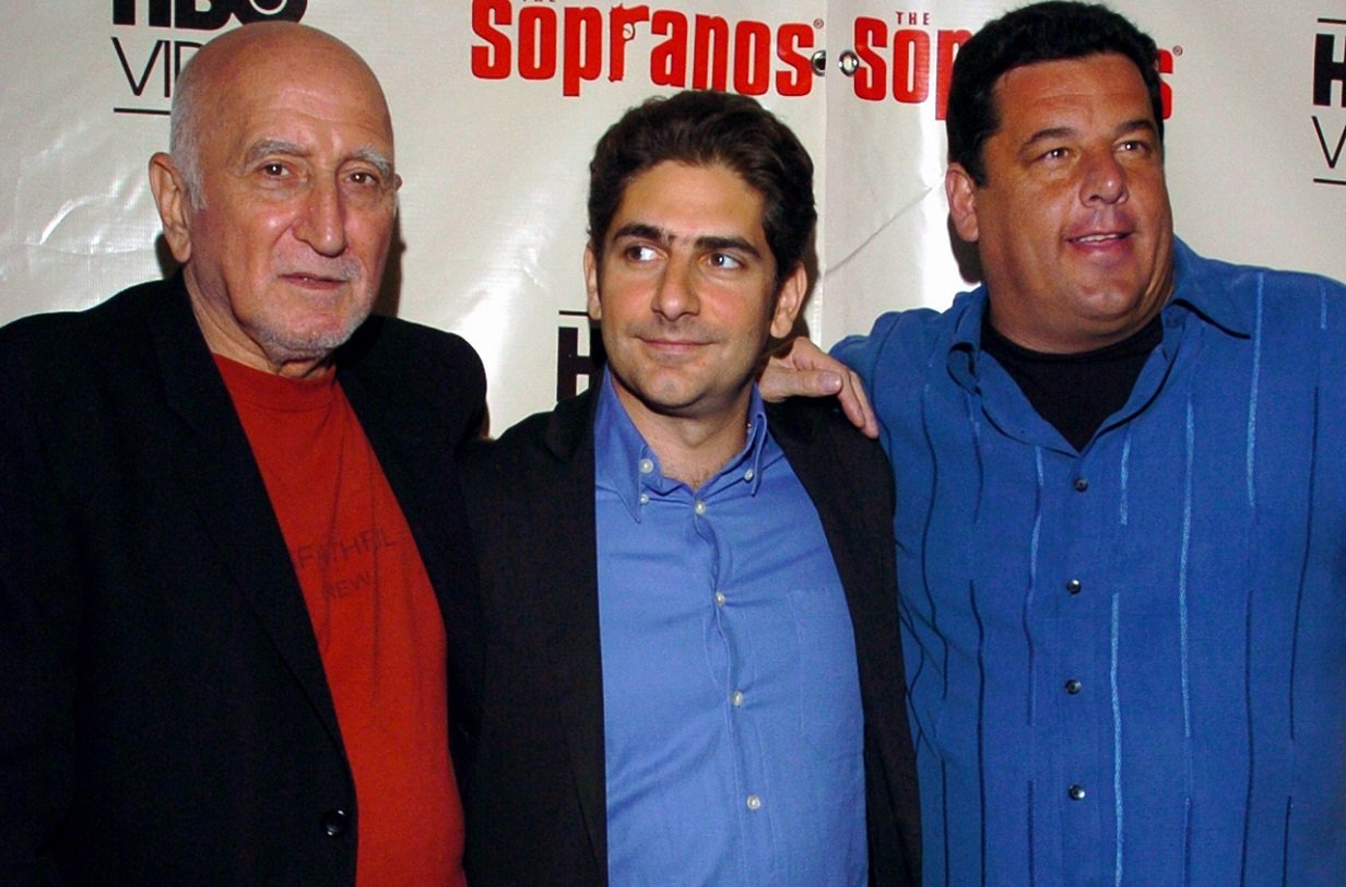 Dominic Chianese, Michael Imperioli, and Steve Schirripa pose together and smile at a 'Sopranos' premiere.