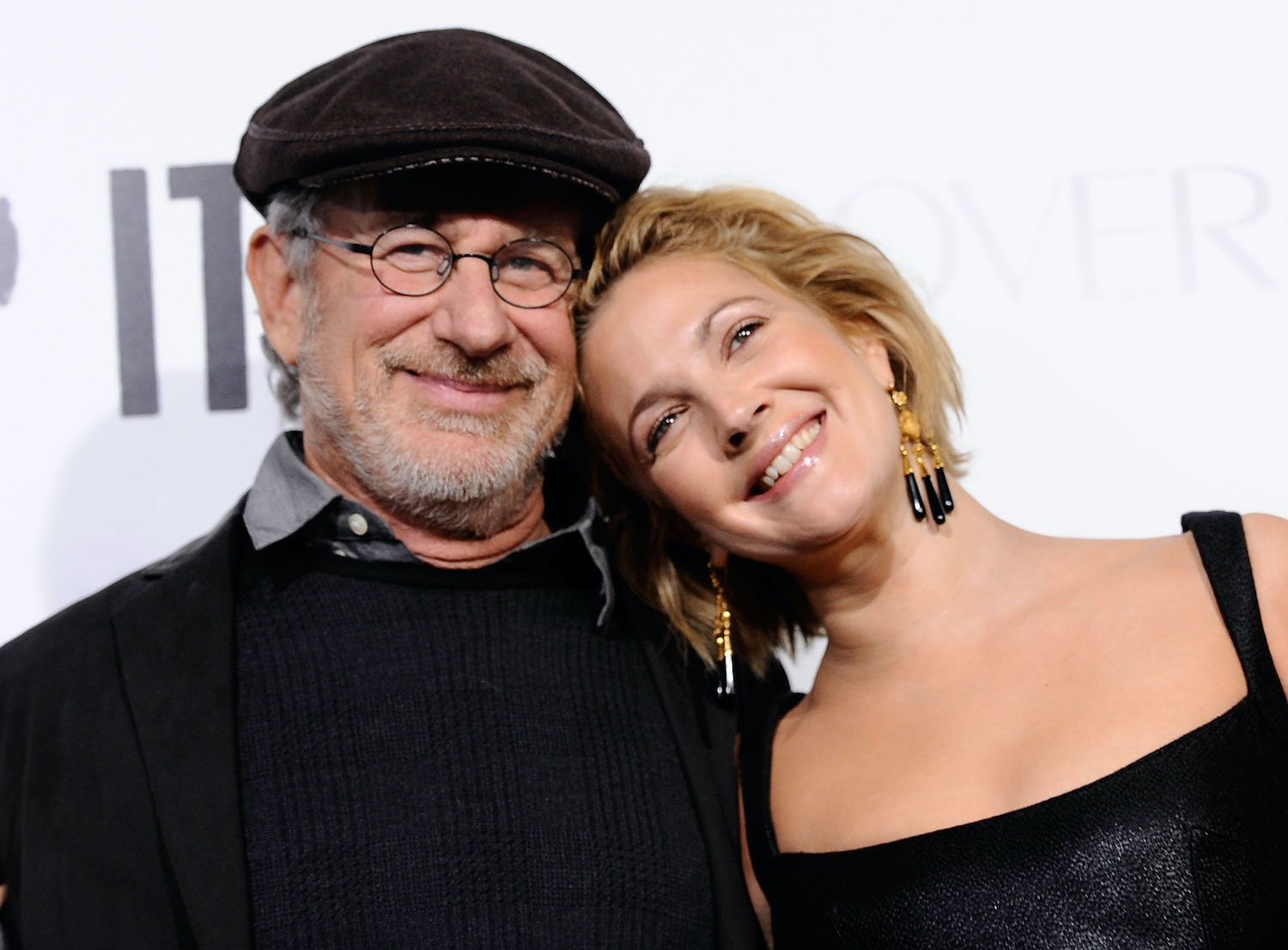 Steven Spielberg and Drew Barrymore smile on the red carpet at the premiere of 'Whip It' in 2009