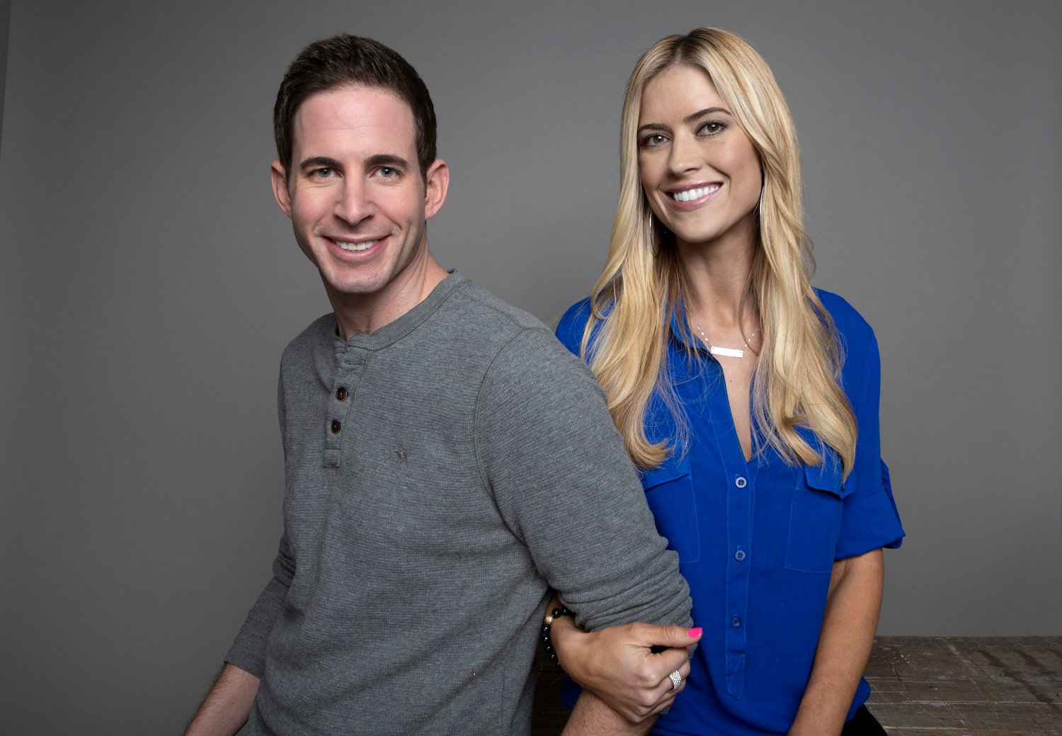 Tarek El Moussa and Christina Haack smiling for a promo still for 'Flip or Flop' in 2017