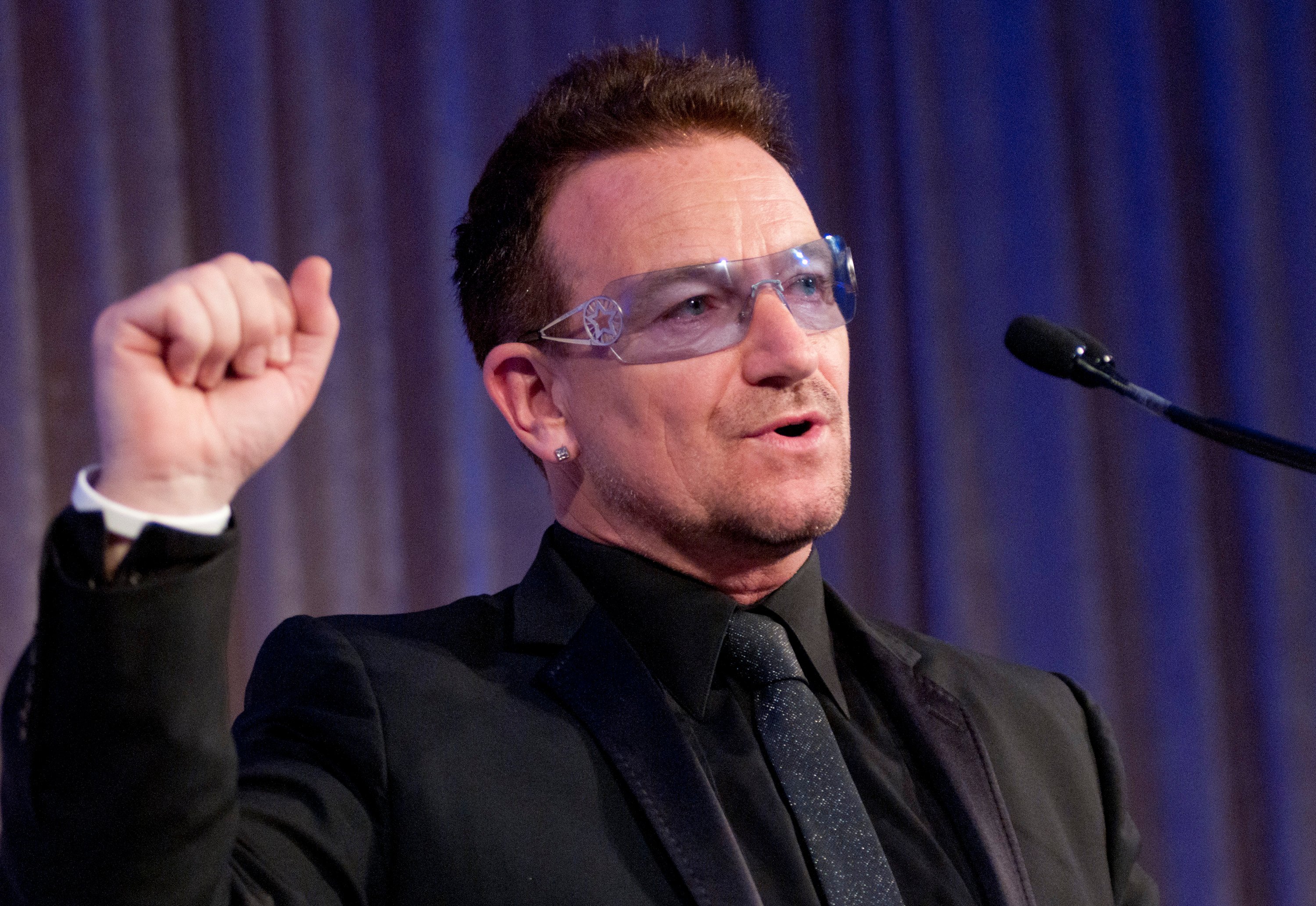 U2's Bono raising his fist