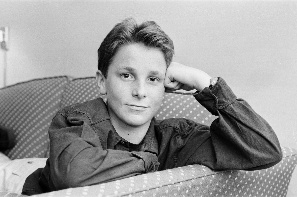 A young Christian Bale poses for the camera in 1988