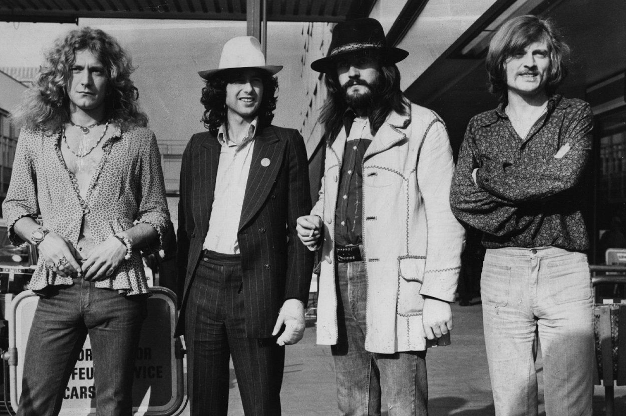 The members of Led Zeppelin pose together at an airport, circa '73.