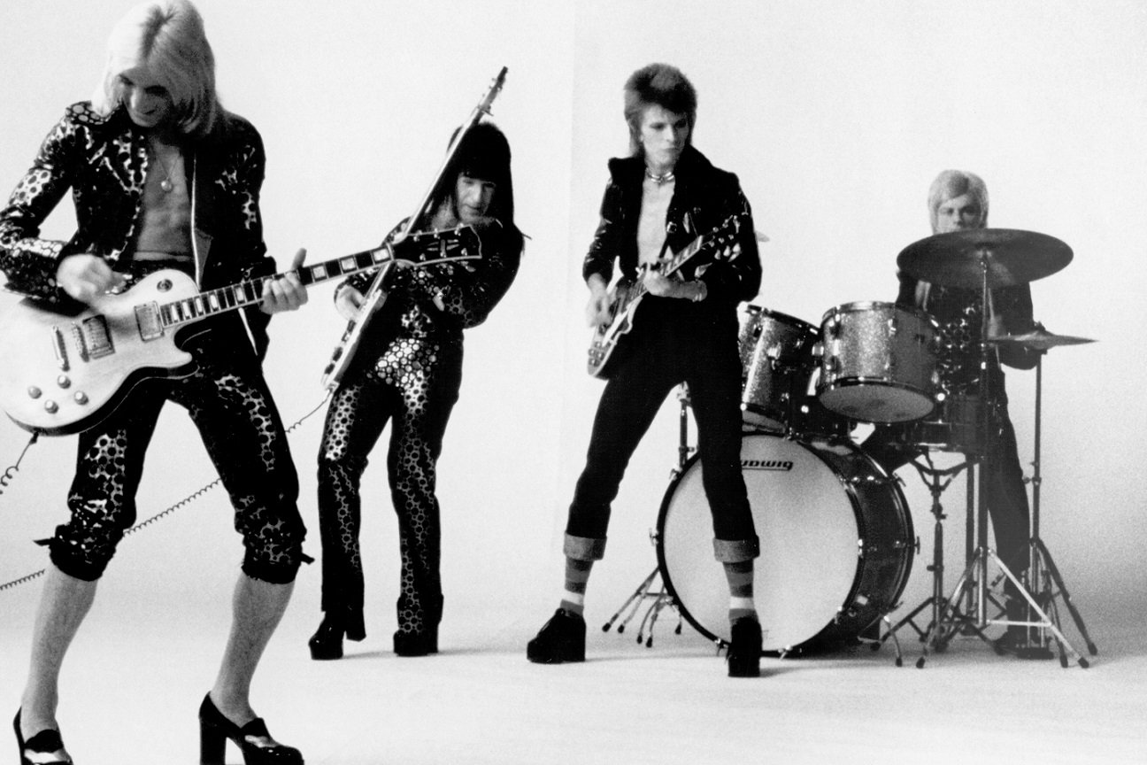 Guitarist Mick Ronson, bassist Trevor Bolder, David Bowie, and drummer Mick Woodmansey of "Ziggy Stardust And The Spiders From Mars" pose for a portrait in November 1972.