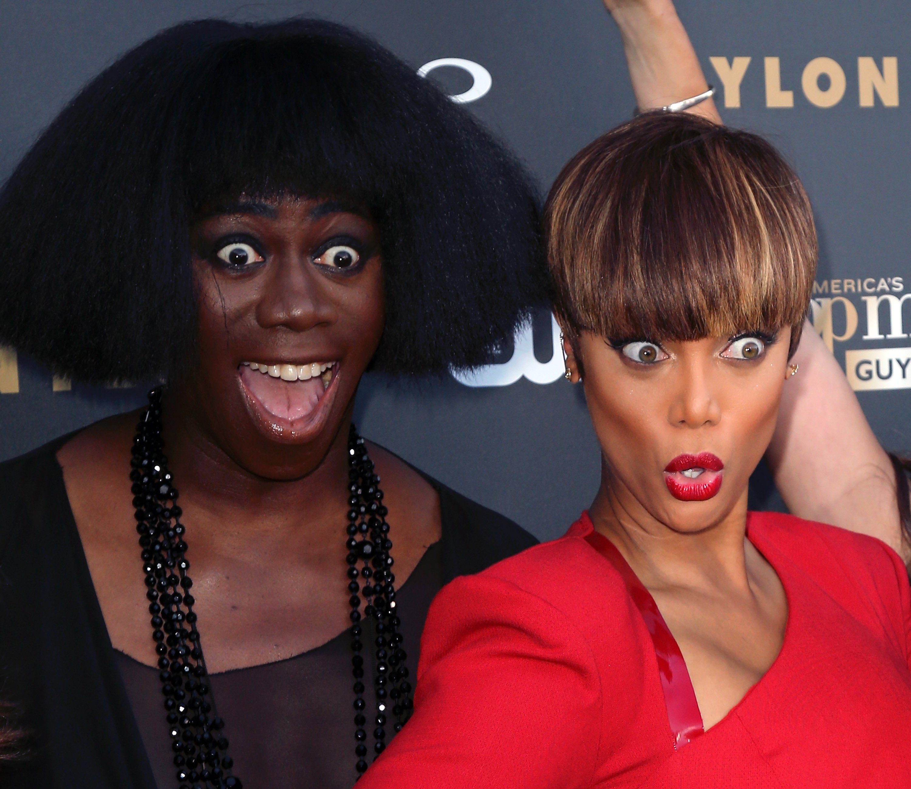 'ANTM' host Tyra Banks and Miss J. Alexander posing at the premiere of a new season.