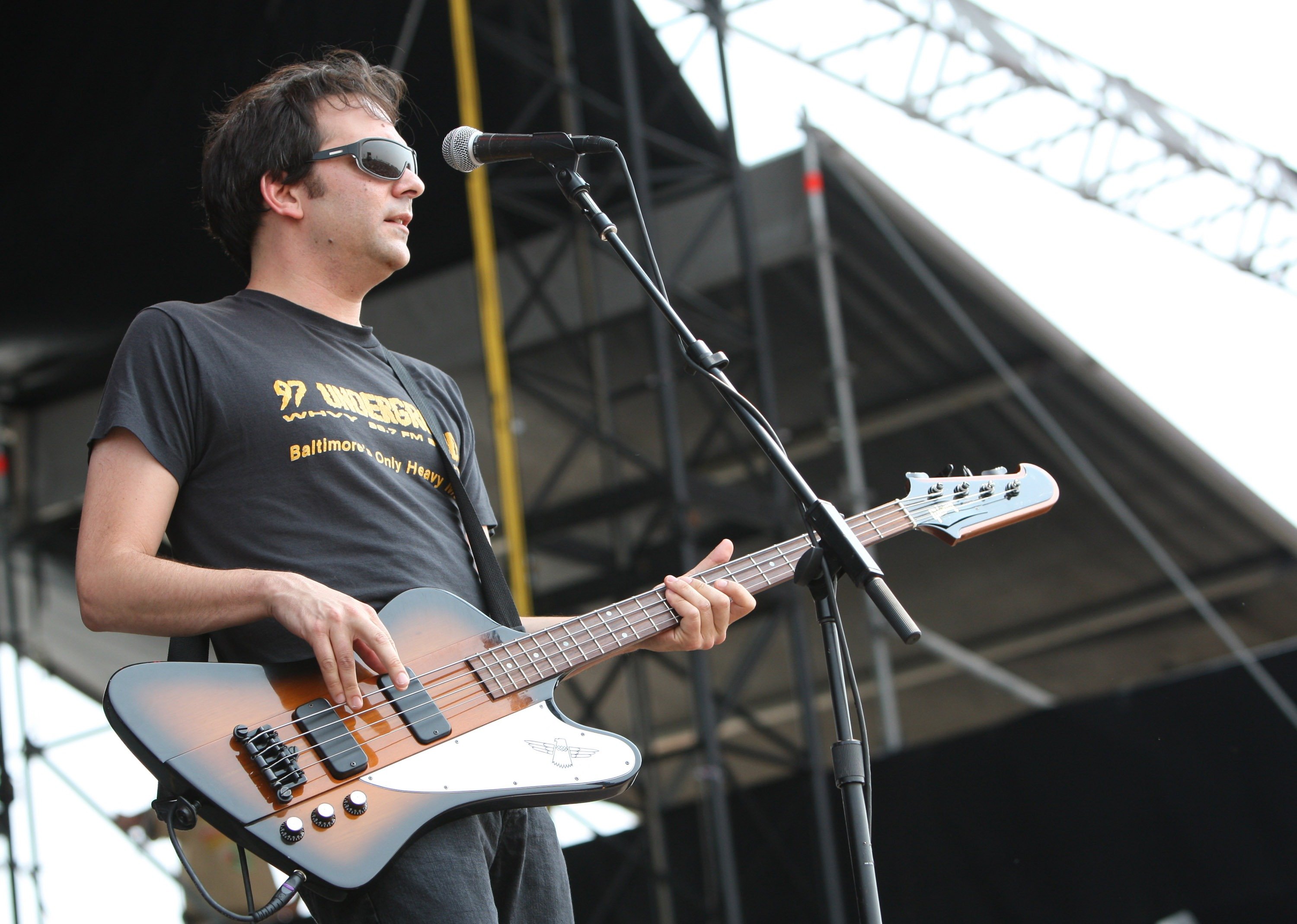 Adam Schlesinger of Fountains of Wayne holding a guitar