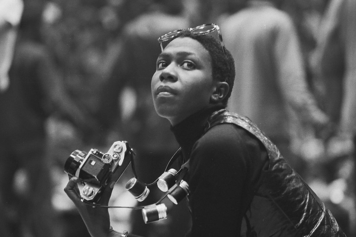 Political & social activist and Black Panther member Afeni Shakur holds a camera as she attends a session of the Revolutionary People's Constitutional Convention, Philadelphia, Pennsylvania, between September 4 and 7, 1970