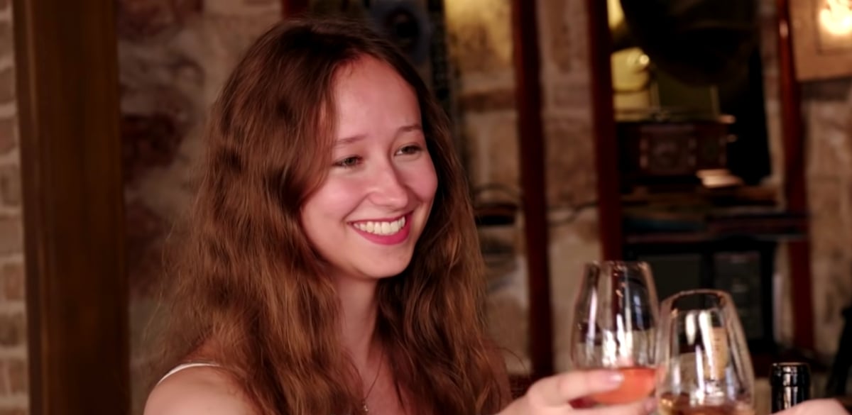 Alina on ’90 Day Fiancé: The Other Way,' clinking wine glasses with Steven, who is off camera