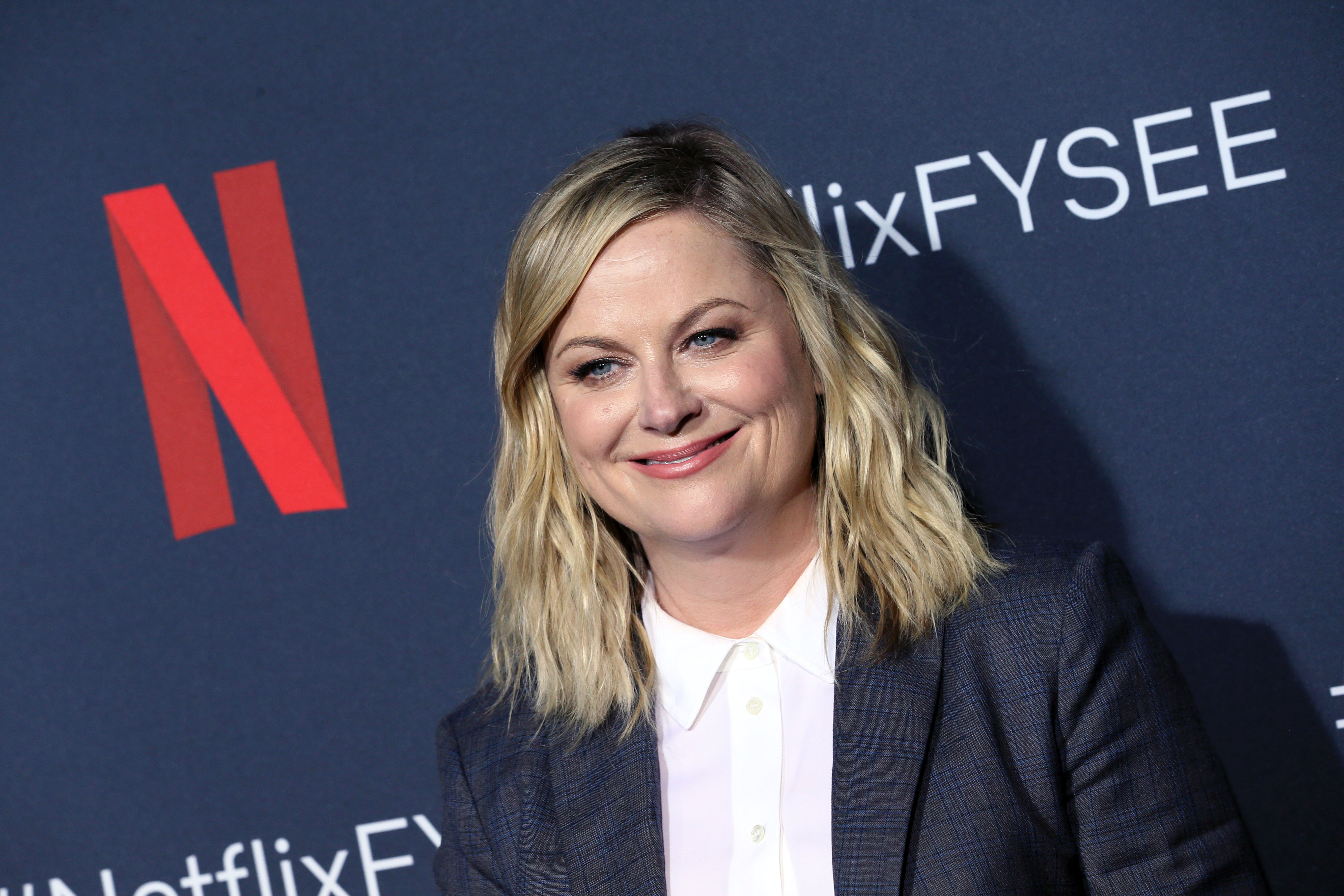 Amy Poehler smiles for a photo at Neflix's FYSEE event for 'Russian Doll'