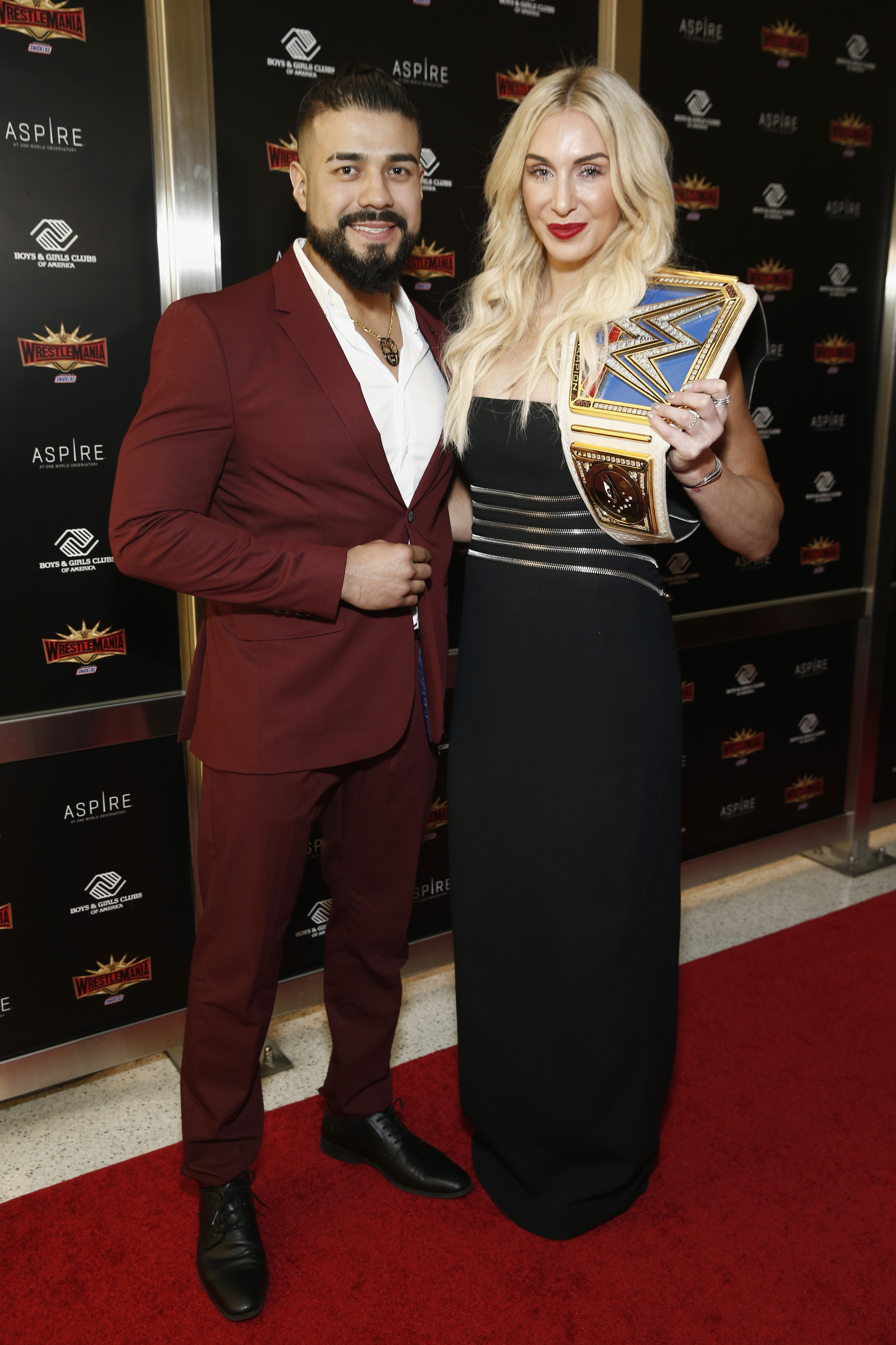 WWE stars Andrade "Cien" Almas and Charlotte Flair attend the 2019 Hall of Fame ceremony.