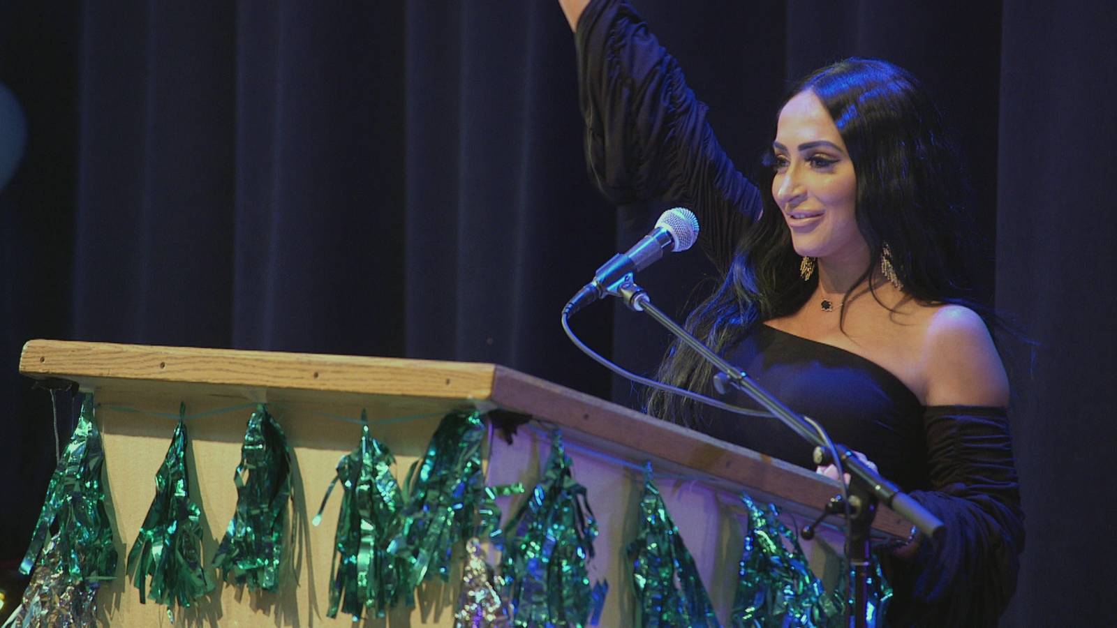 Angelina Pivarnick at the podium giving her speech at Jenni 'JWoww' Farley's birthday party in 'Jersey Shore: Family Vacation' Season 4