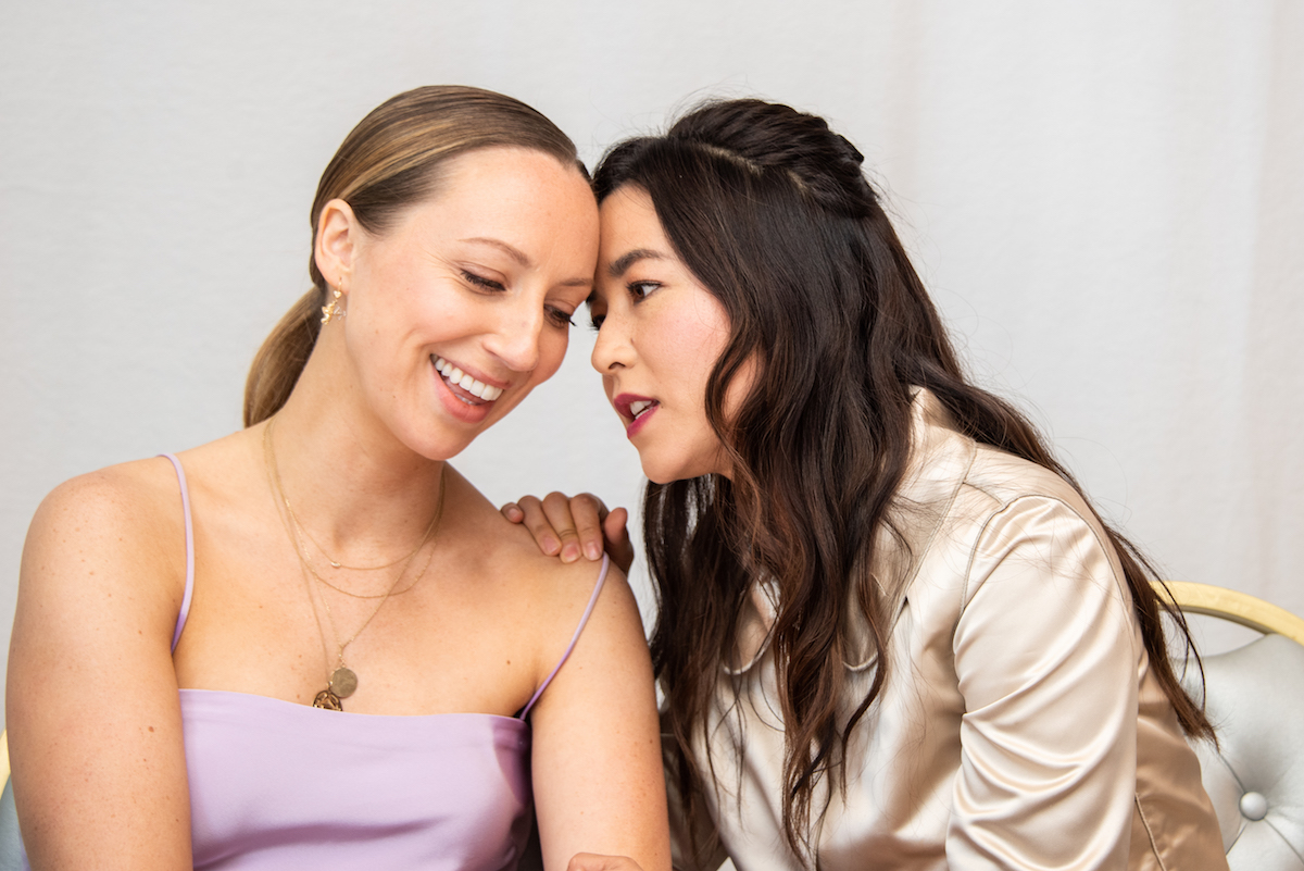 Anna Konkle and Maya Erskine touching heads at a 'PEN15' press conference.