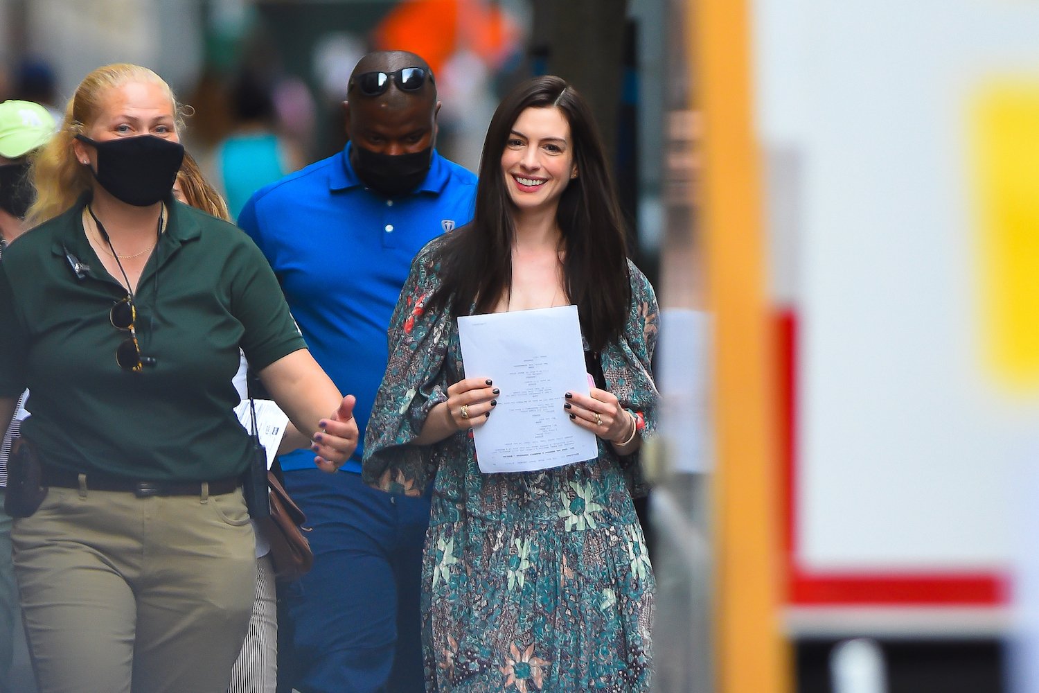 Anne Hathaway smiling on set of 'WeCrashed' in New York