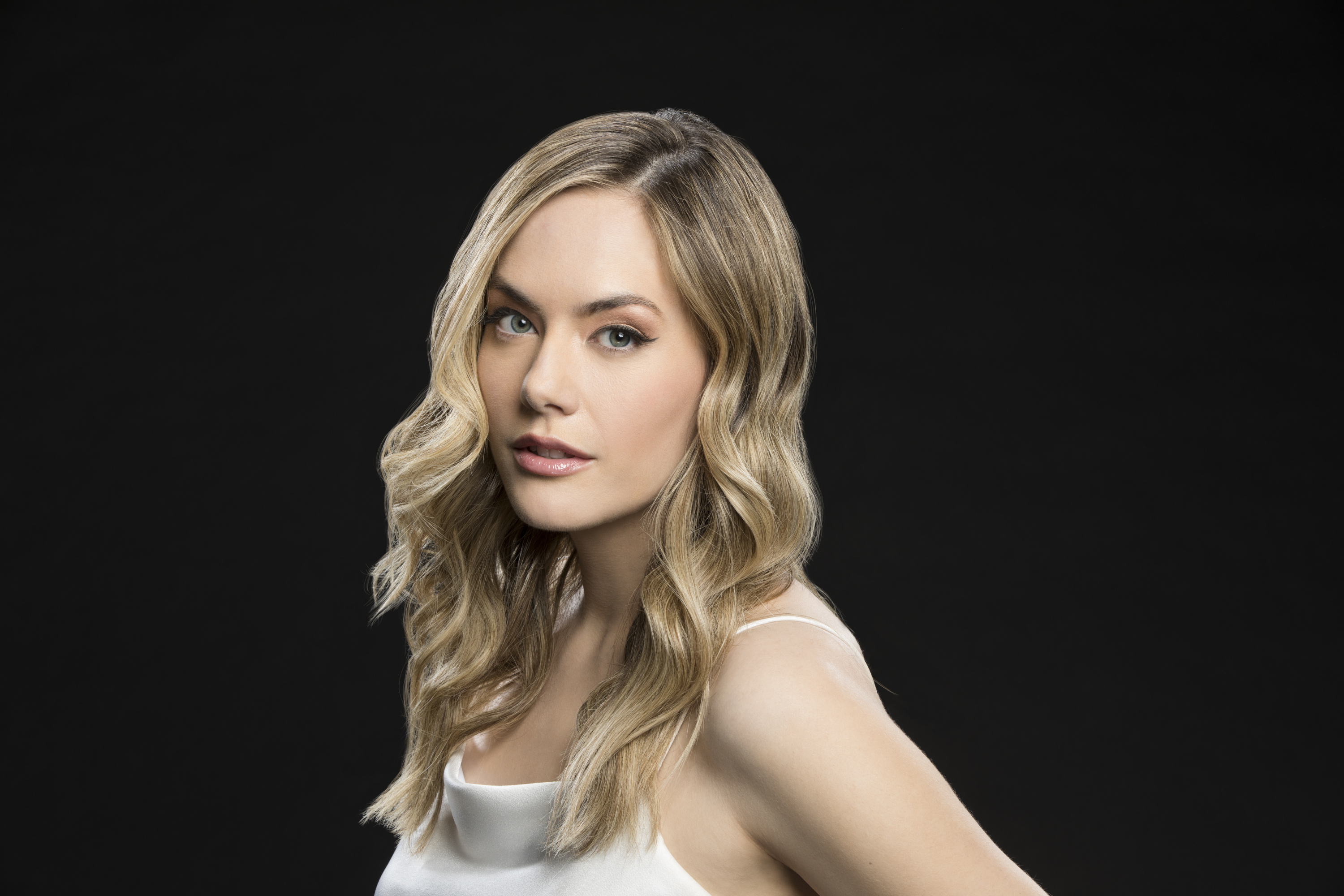 'The Bold and the Beautiful' actor Annika Noelle wears a white dress in a  promotional photoshoot for the CBS soap opera.