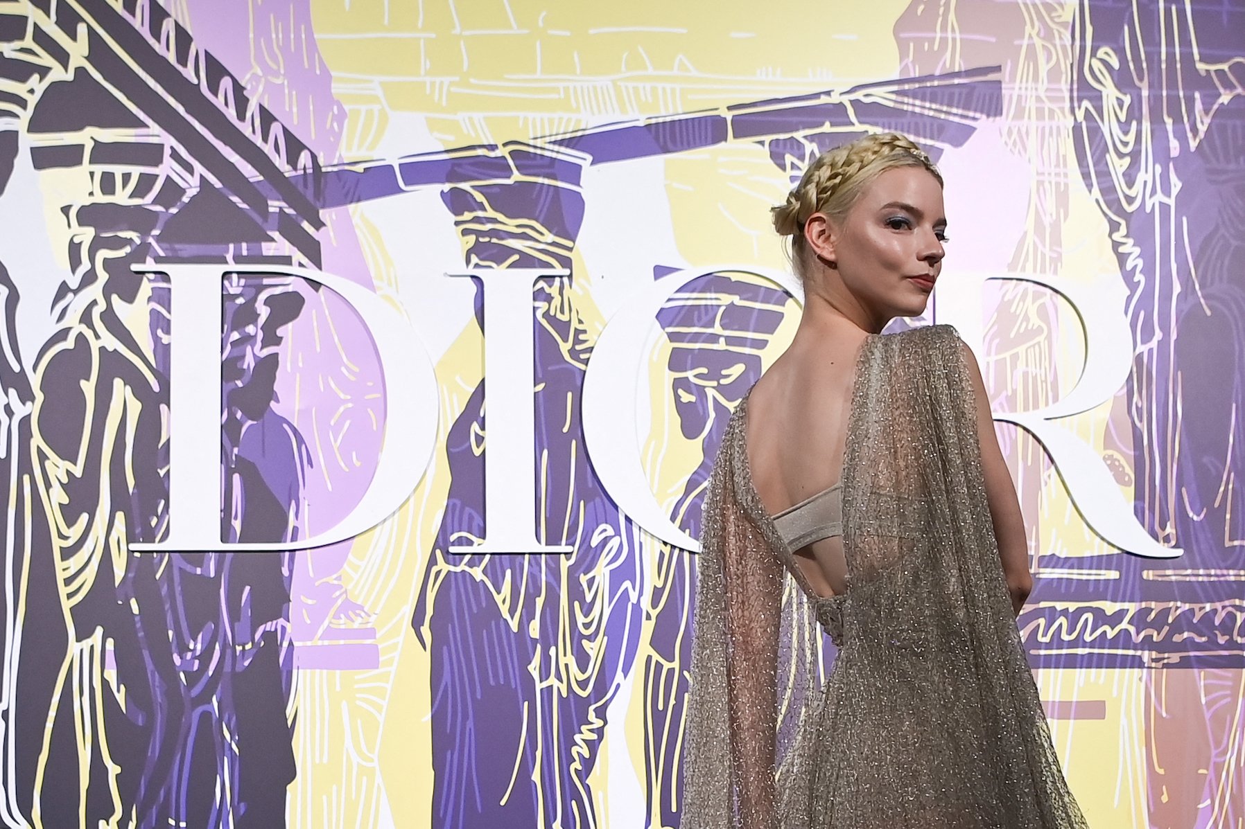 Anya Taylor-Joy, 'Peaky Blinders' Season 6 actor playing Gina Gray, posing in a sparkly dress at a Dior event