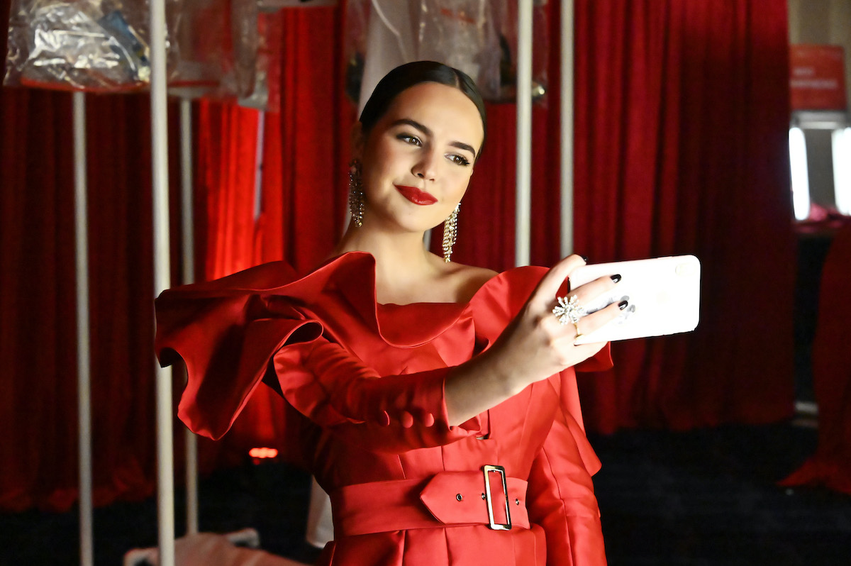 movie and TV star Bailee Madison takes a selfie in a red dress