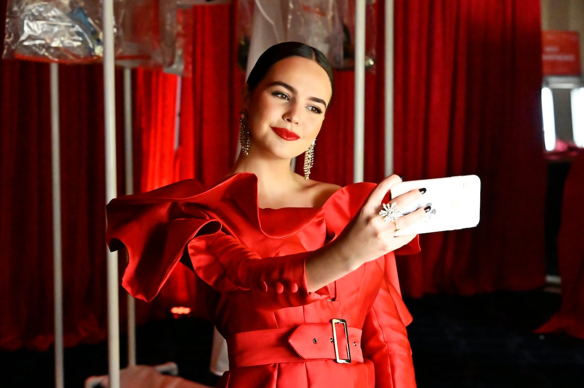 movie and TV star Bailee Madison takes a selfie in a red dress