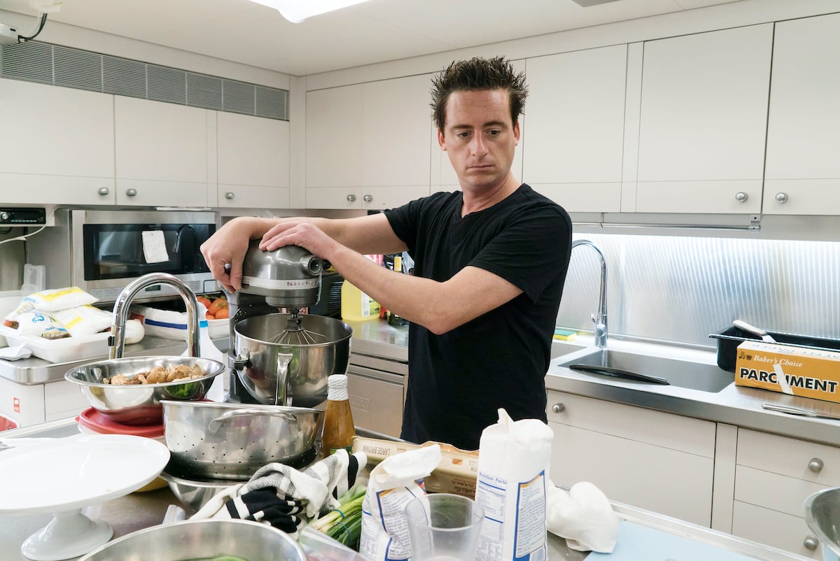 Chef Ben Robinson from Below Deck whips up dinner for the guests in the galley kitchen 