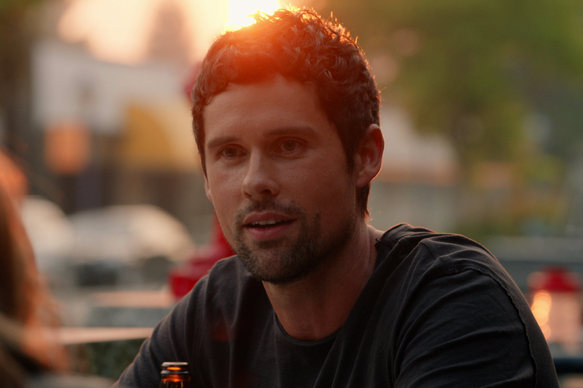 Ben Hollingsworth as Dan Brady enjoying a beer at sunset in 'Virgin River