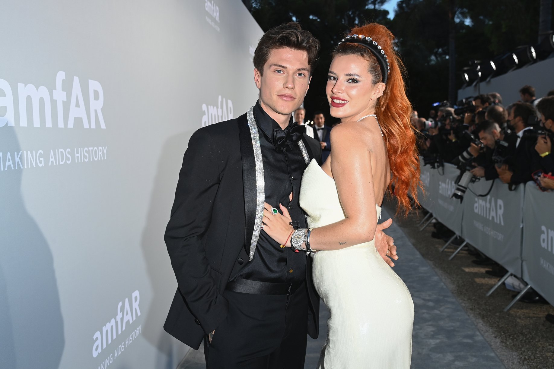 Benjamin Mascolo and Bella Thorne 'Time Is Up' waering blax suit and white dress