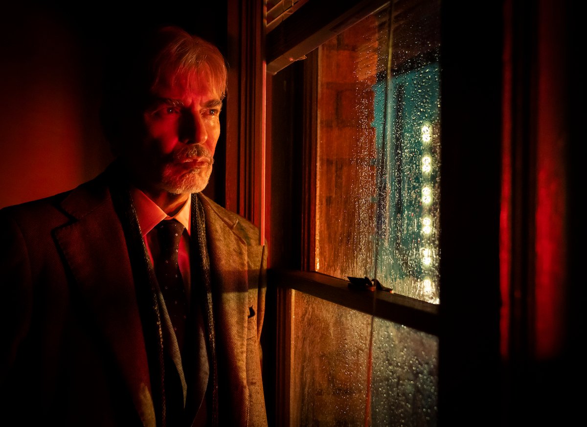 Billy Bob Thornton standing in front of a window in 'Goliath'